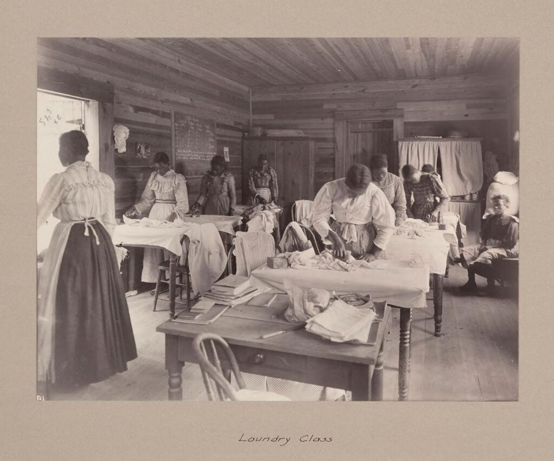 Social Settlements: United States. Alabama. Calhoun. "Calhoun Colored School": Agencies Promoting Assimilation of the Negro. Training Negro Girls in Domestic Science. Calhoun Colored School, Calhoun, Ala.: Laundry Class. by Attributed to Frances Benjamin Johnston