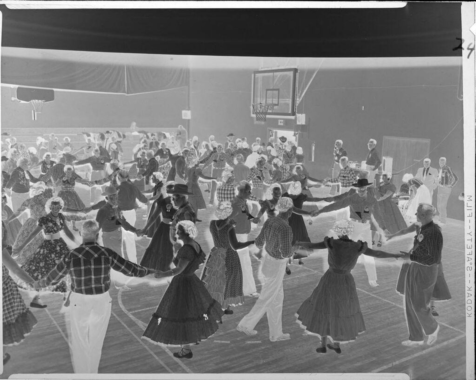 Untitled (people dancing in gymnasium) by Ken Whitmire Associates
