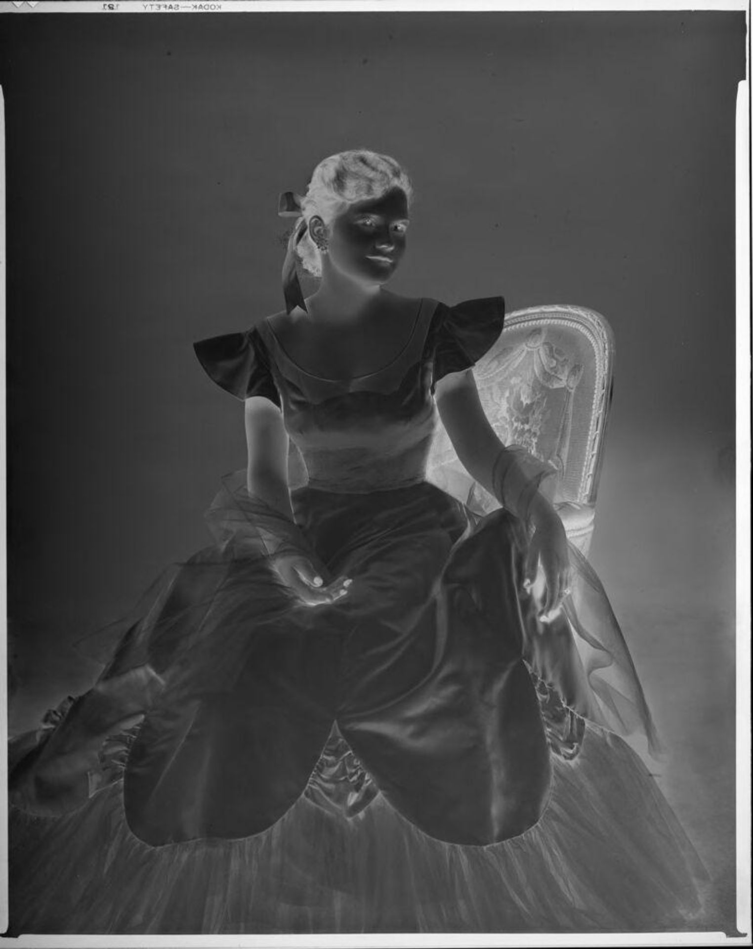 Untitled (Eugenie Stoll in formal gown) by C. Bennette Moore