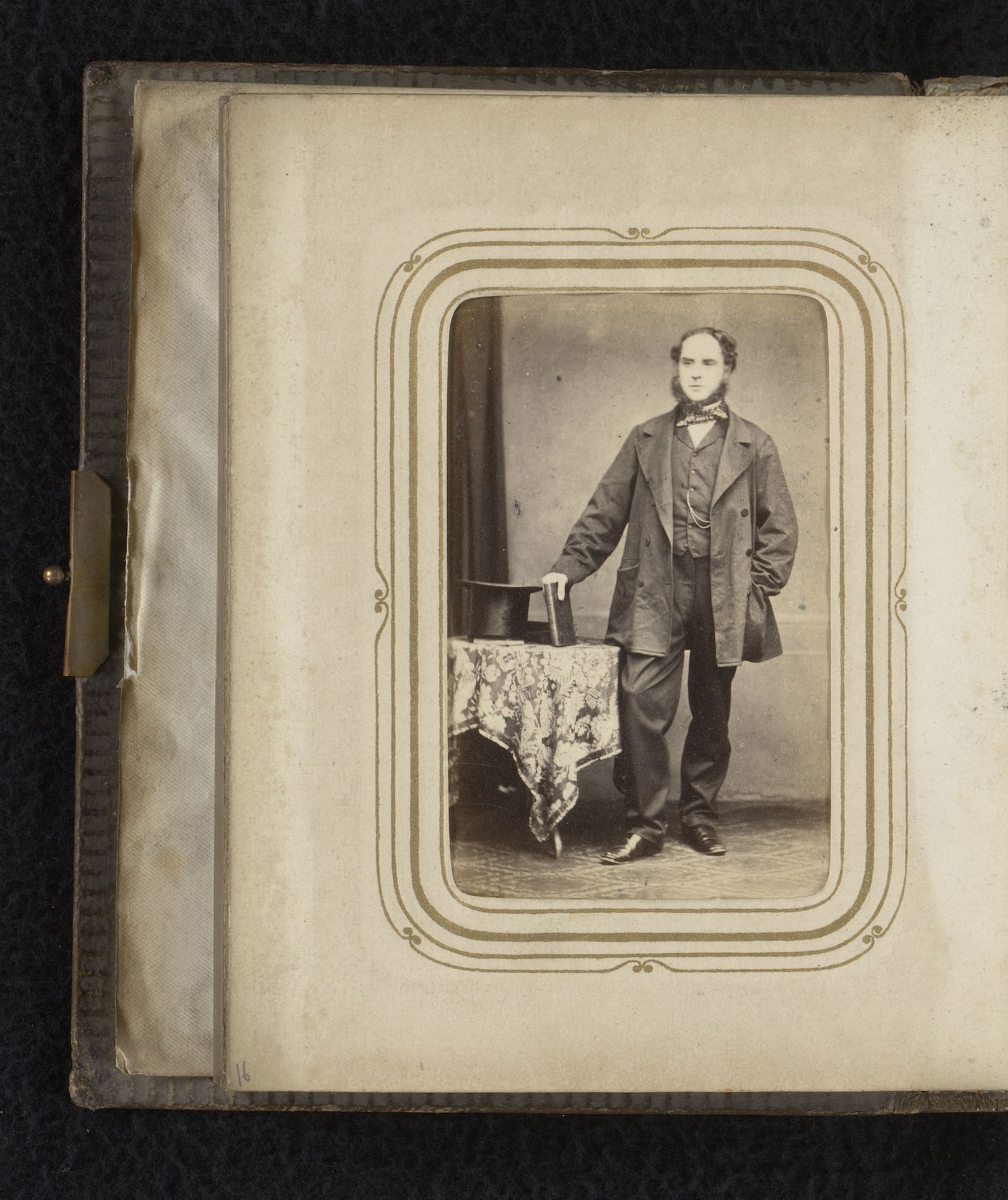 Portret van een man met bakkebaarden, staand bij een tafel met boek en hoed by R. Griffiths