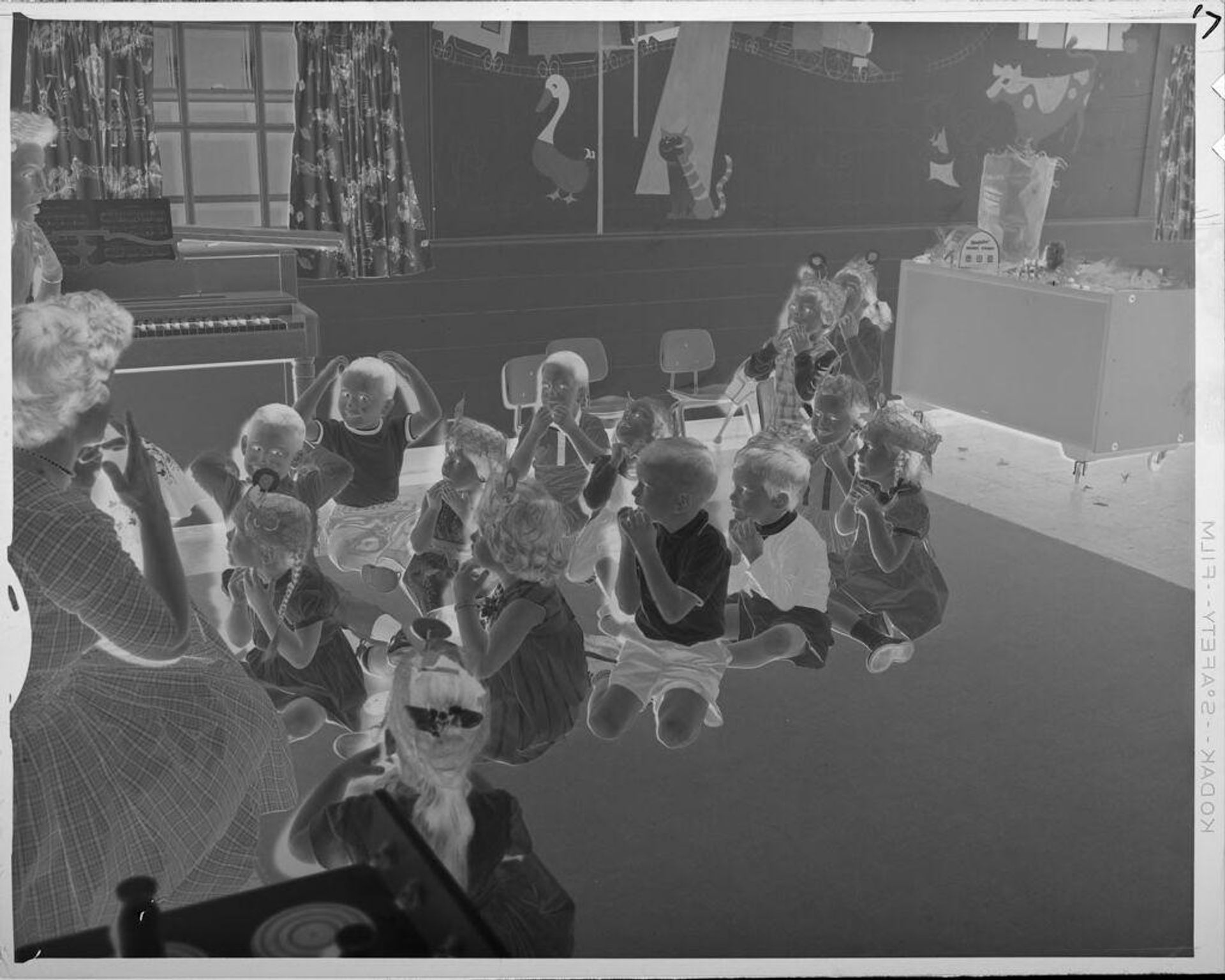 Untitled (children on floor in classroom) by Lucian and Mary Brown