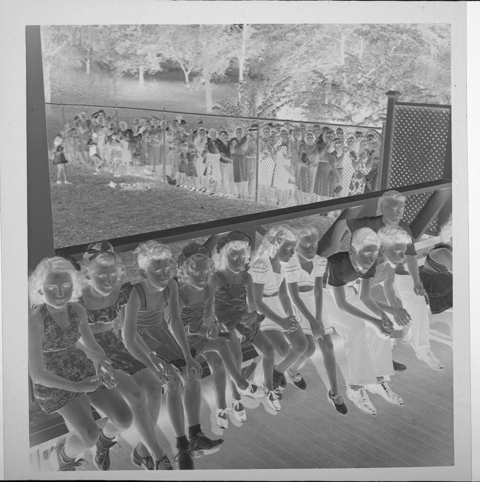 Untitled (children in costumes auditioning for theater, sitting in long line ) by Jack Gould