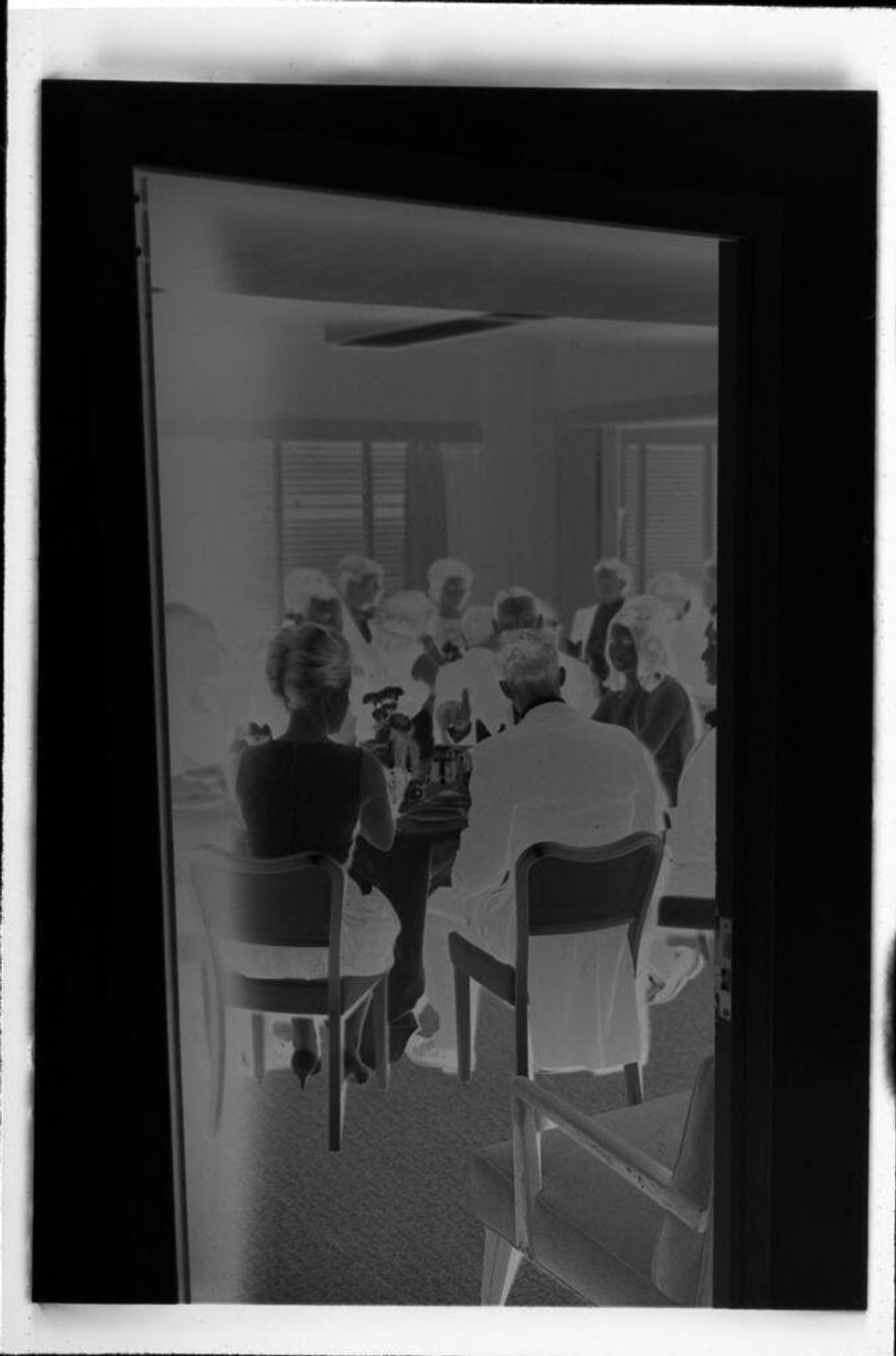 Untitled (people at dinner party) by Robert Burian