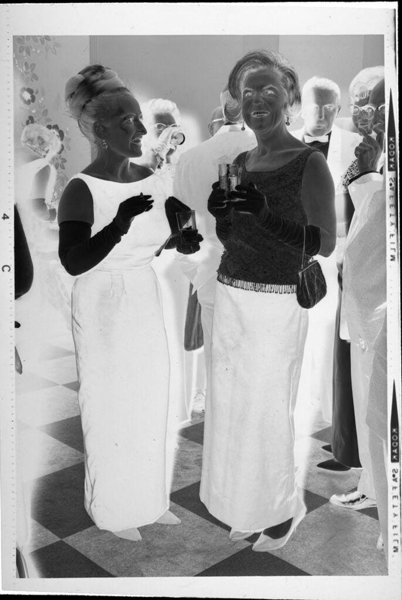 Untitled (guests at party) by Robert Burian