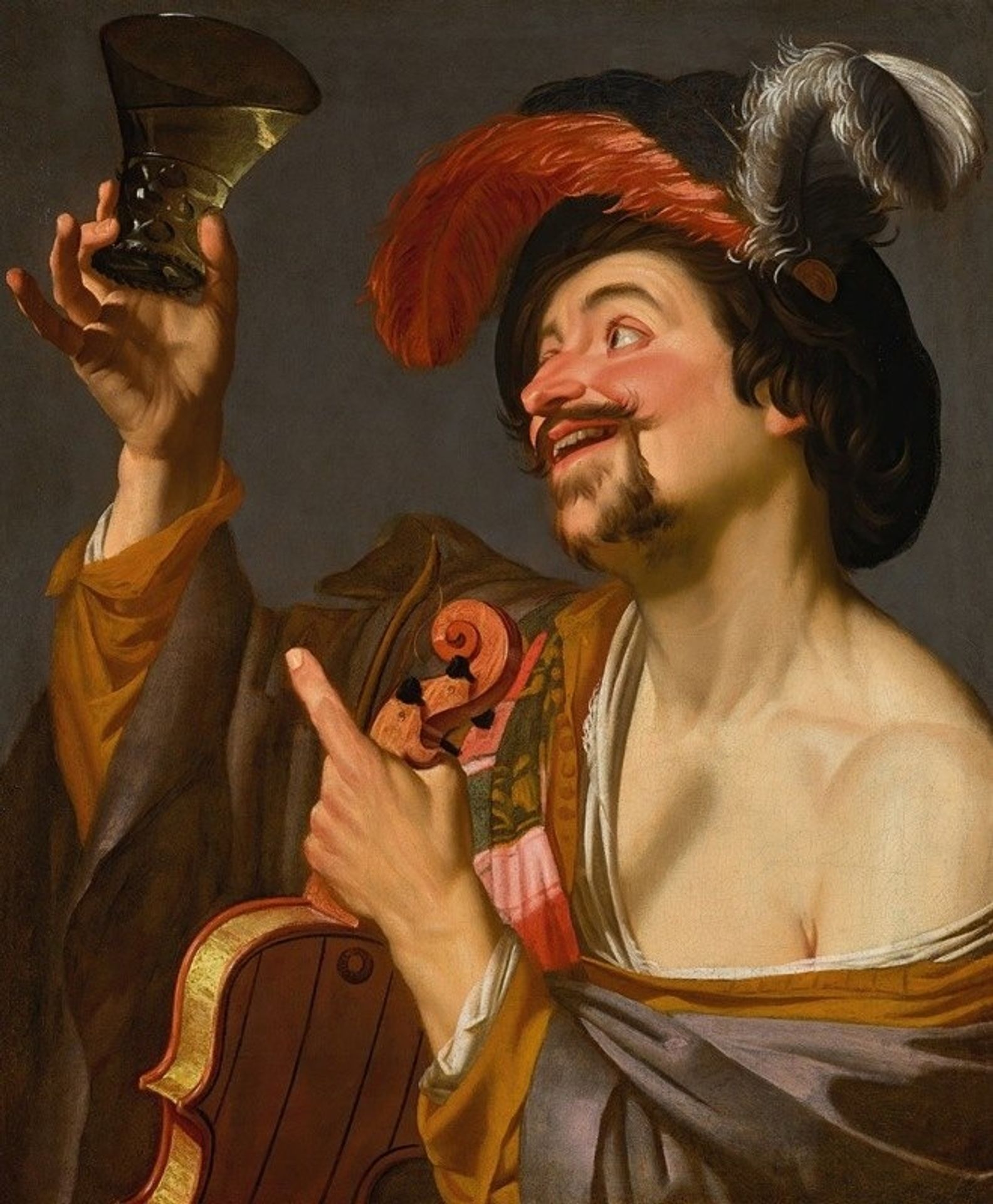A merry violinist holding a roemer by Gerard van Honthorst