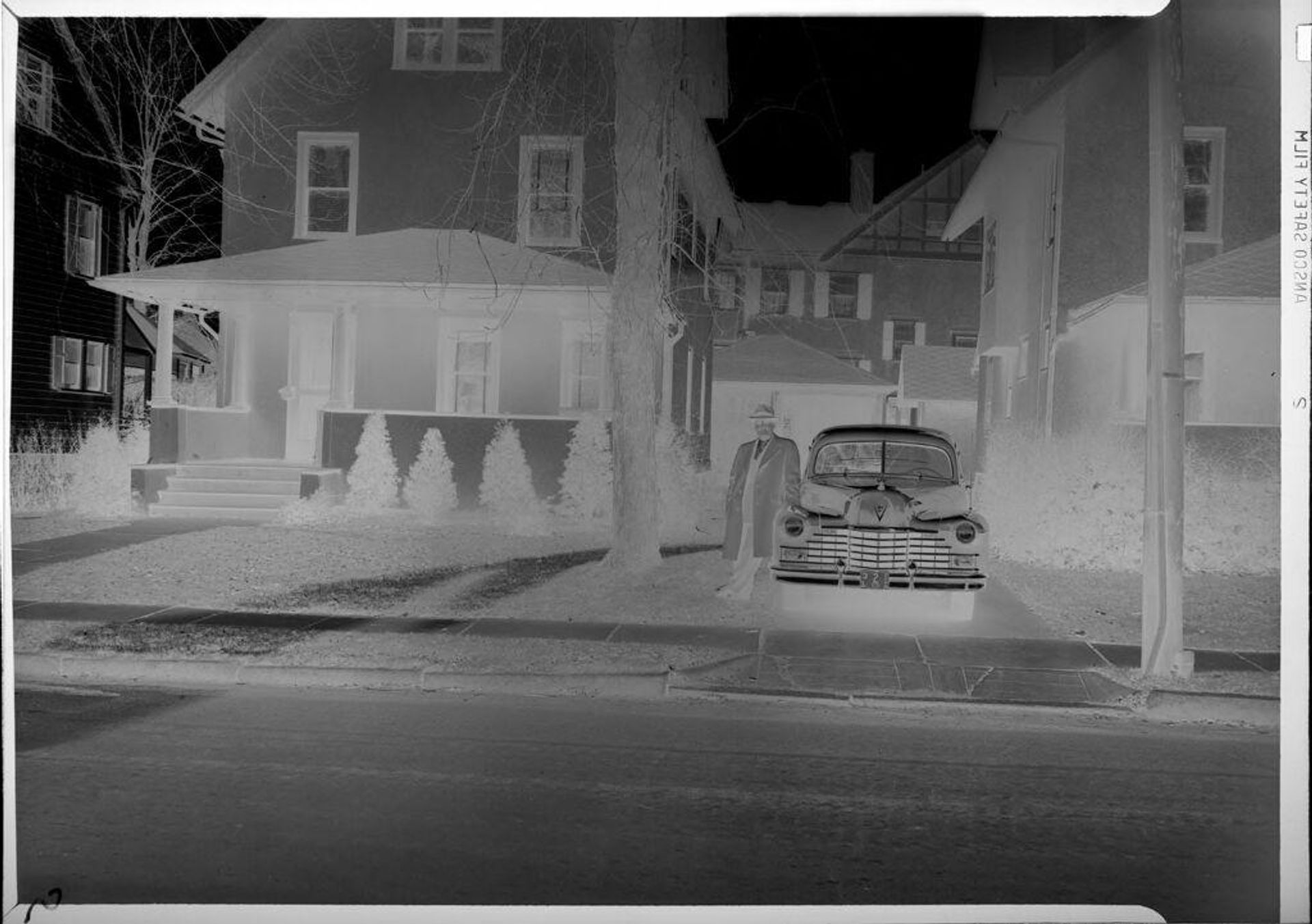 Untitled (man with car in front of house) by Robert Burian