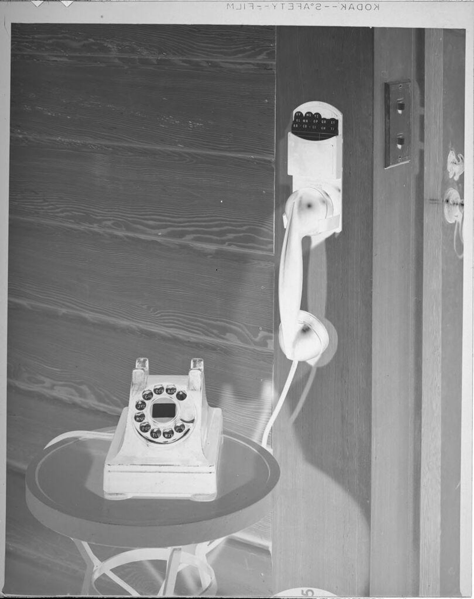 Untitled (rotary telephone with wall mount) by Lucian and Mary Brown