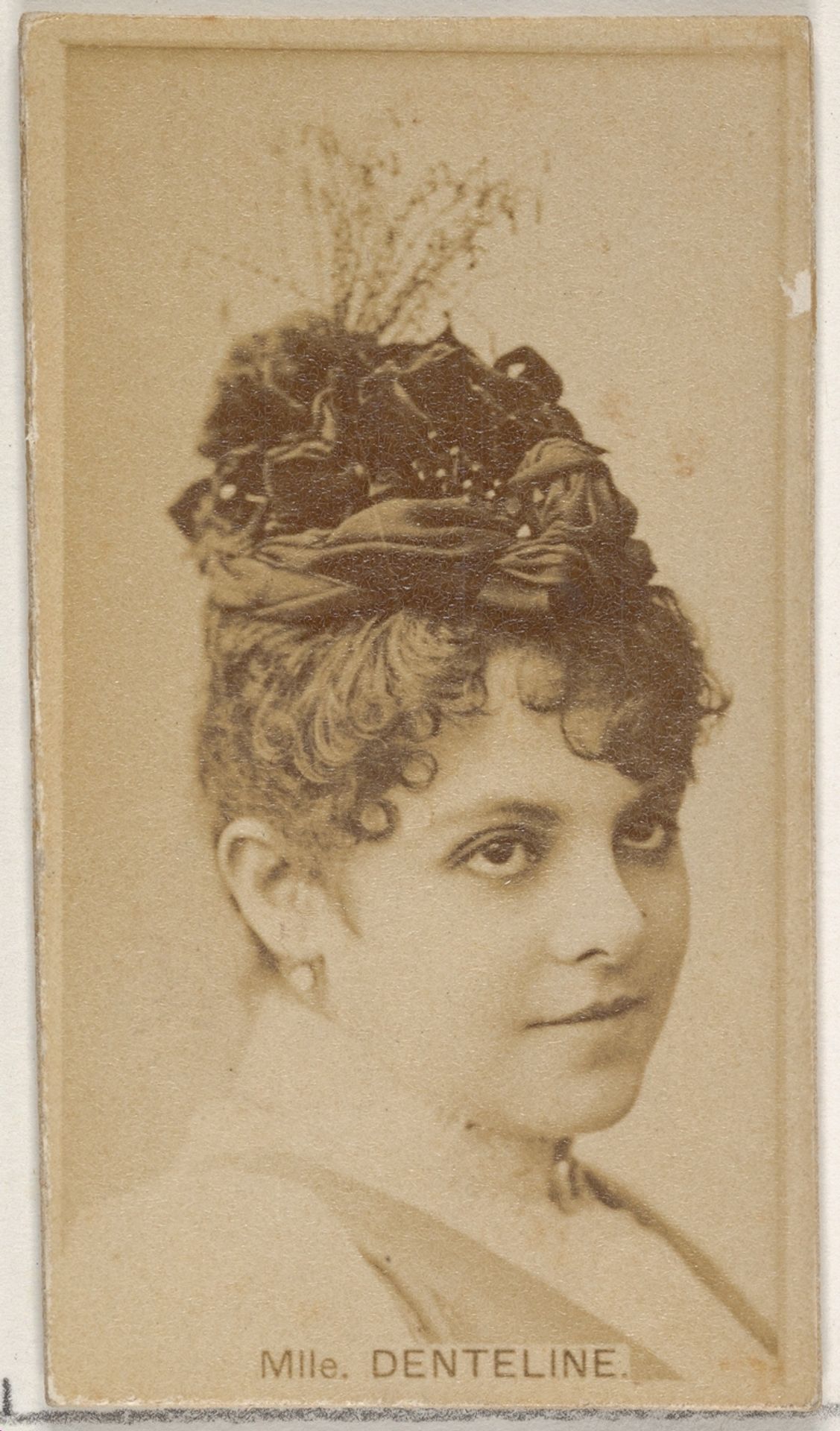 Mlle. Denteline, from the Actors and Actresses series (N45, Type 8) for Virginia Brights Cigarettes by Allen & Ginter