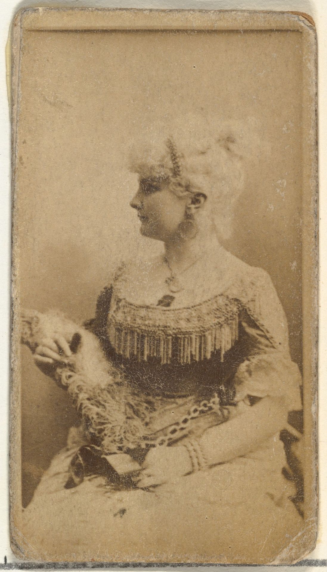 [Actress wearing dress with fringed bodice], from the Actors and Actresses series (N145-8) issued by Duke Sons & Co. to promote Duke Cigarettes by W. Duke, Sons & Co.