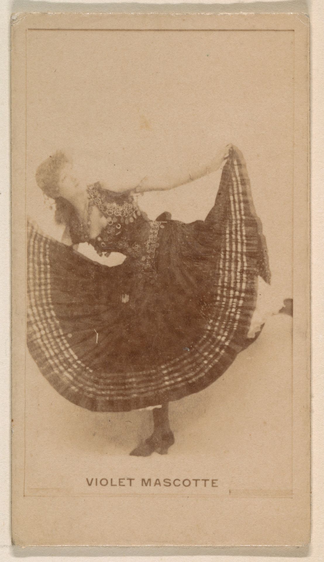 Violet Mascotte, from the Actresses series (N245) issued by Kinney Brothers to promote Sweet Caporal Cigarettes by Kinney Brothers Tobacco Company