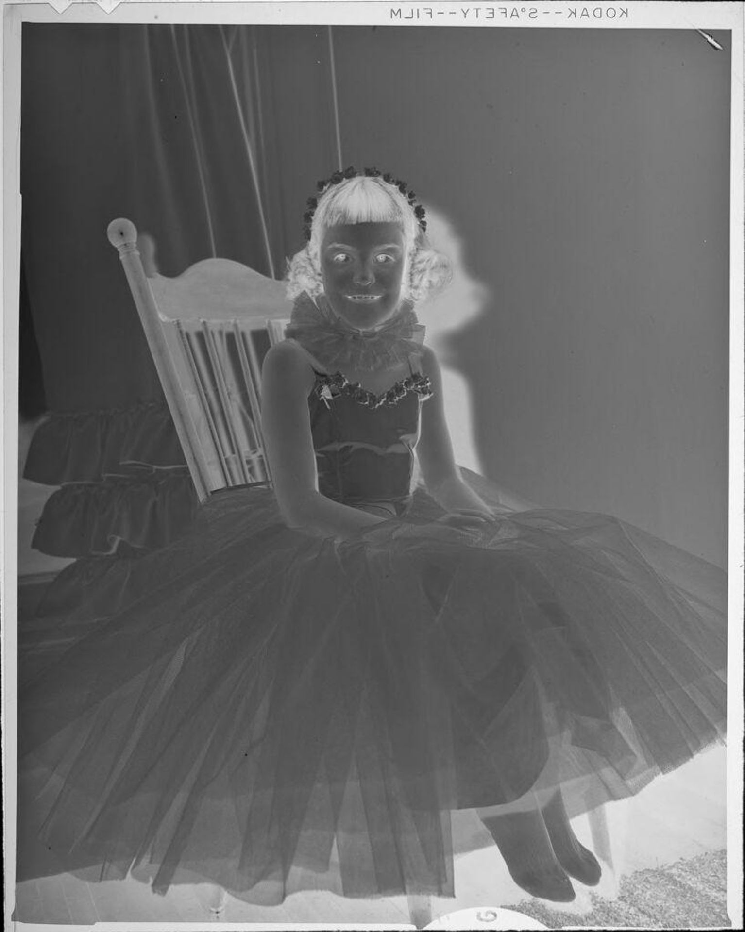 Untitled (girl wearing dress with tulle skirt) by Lucian and Mary Brown