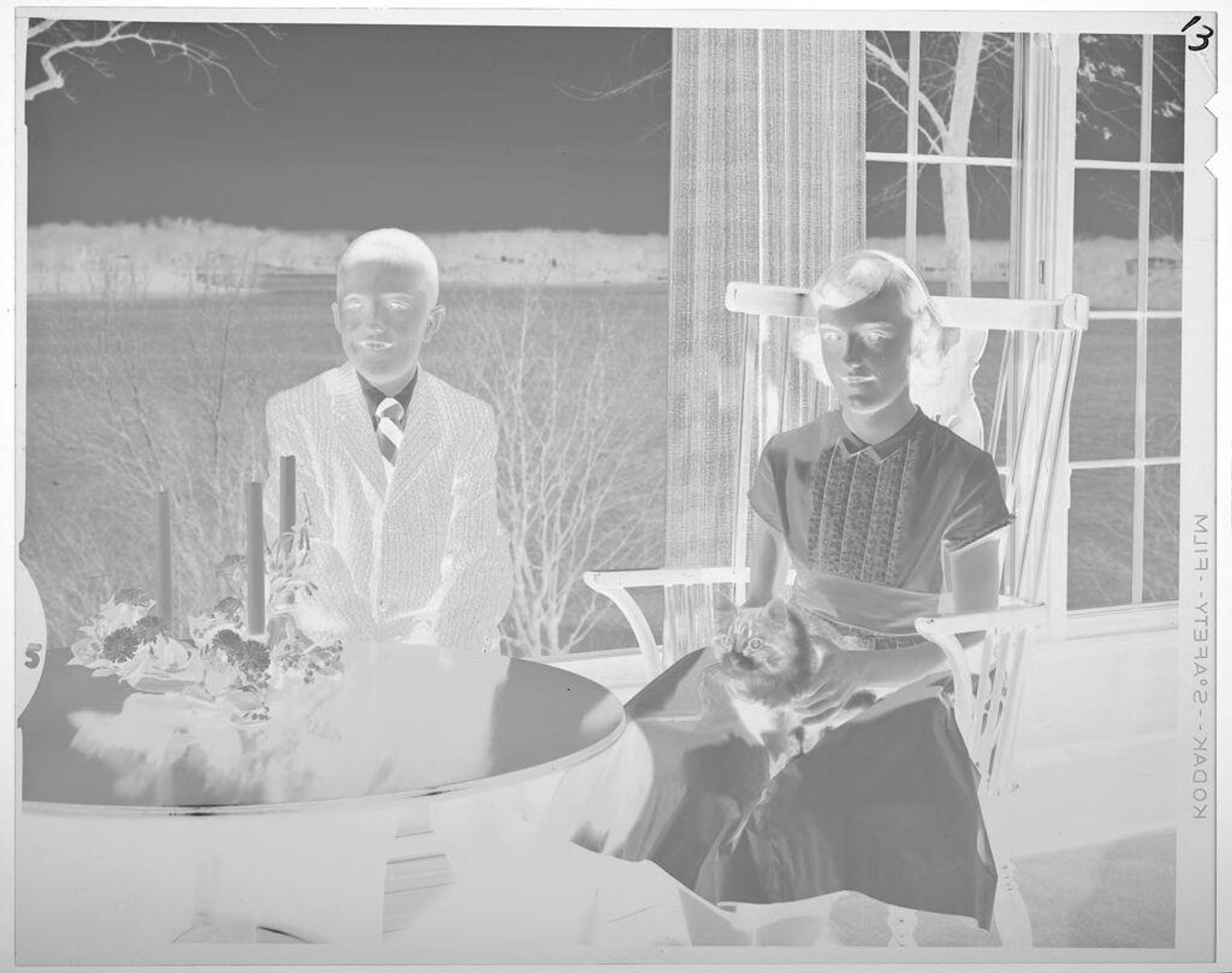 Untitled (boy and girl, seated, wearing formal attire) by Lucian and Mary Brown