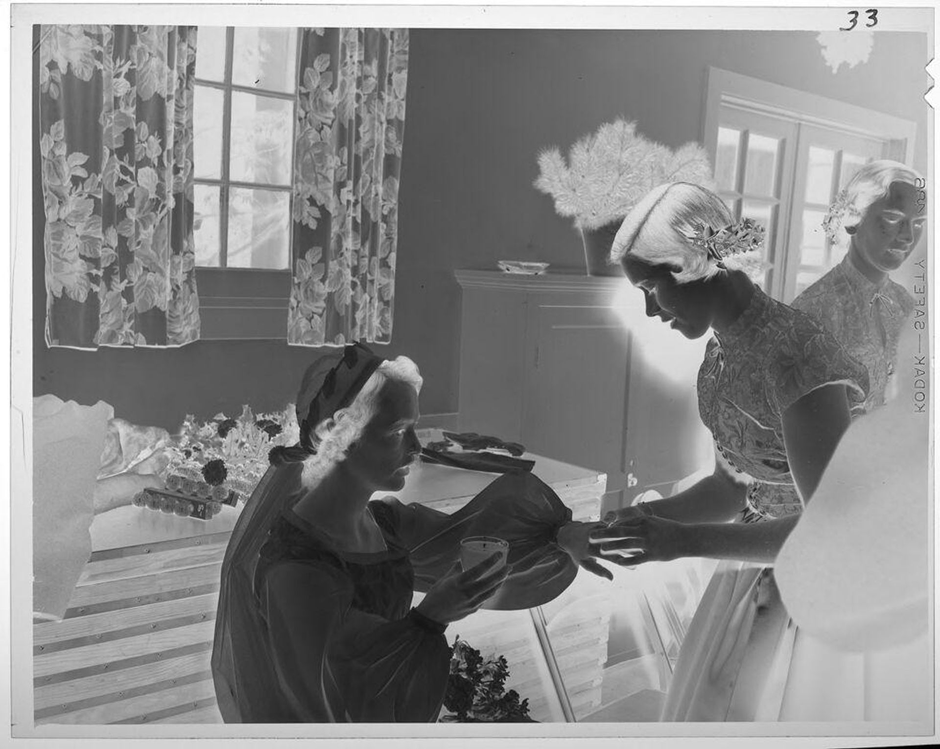 Untitled (bride on couch with other women standing) by Lucian and Mary Brown