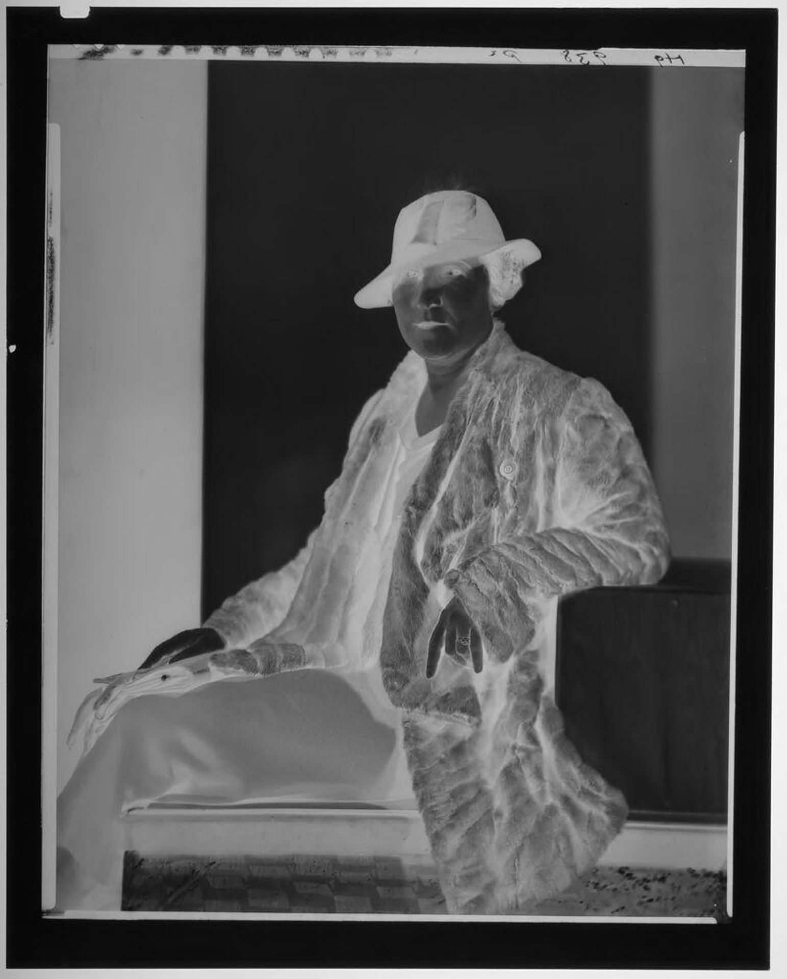 Untitled (studio portrait of woman in hat and fur coat) by Paul Gittings