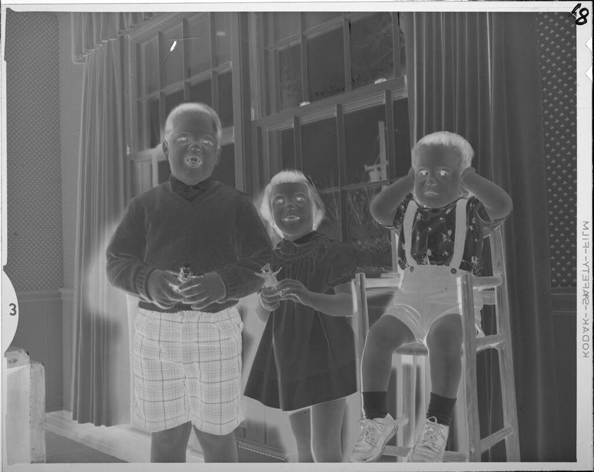 Untitled (three children, baby covering ears) by Lucian and Mary Brown