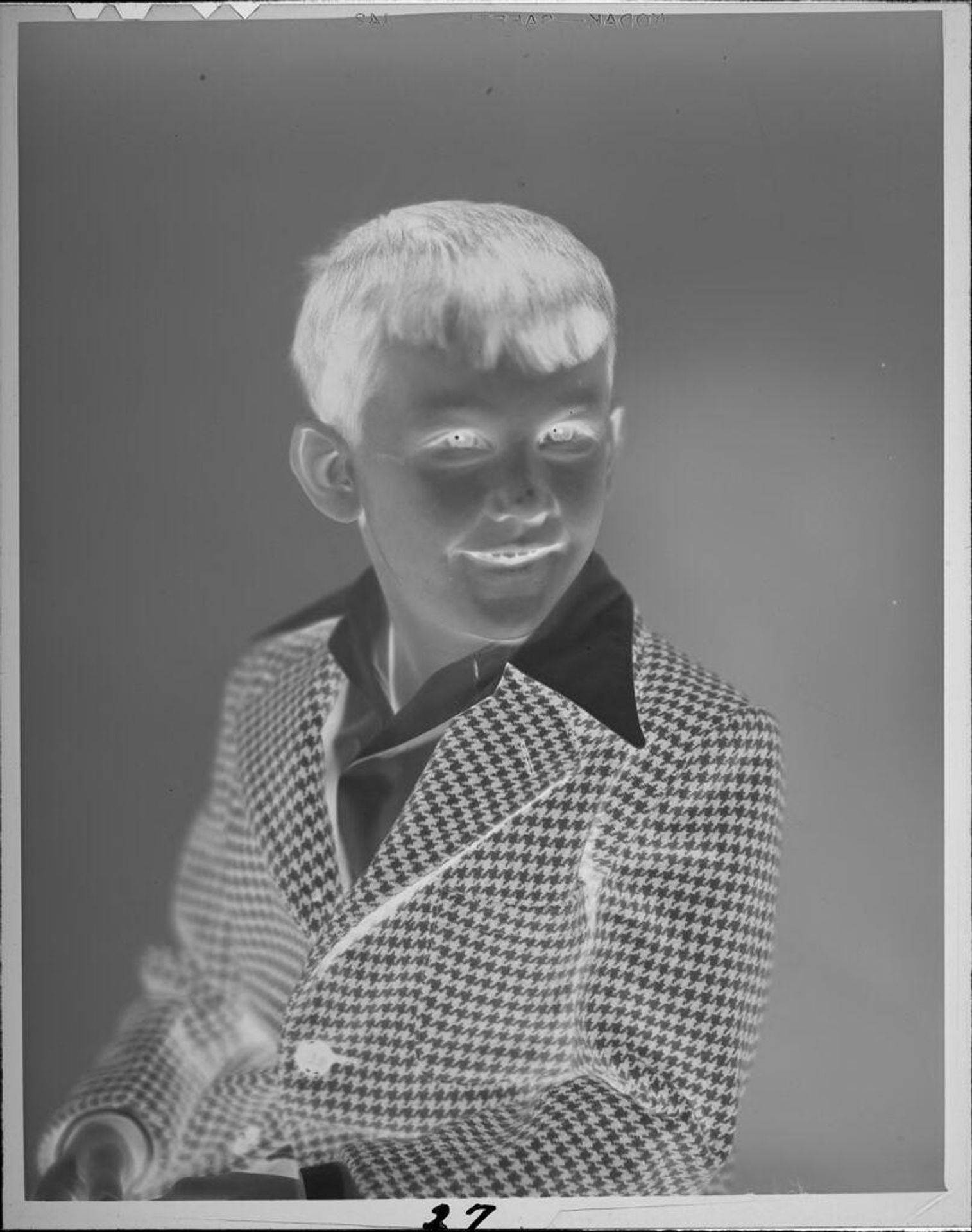 Untitled (portrait of boy in houndstooth jacket) by Lucian and Mary Brown
