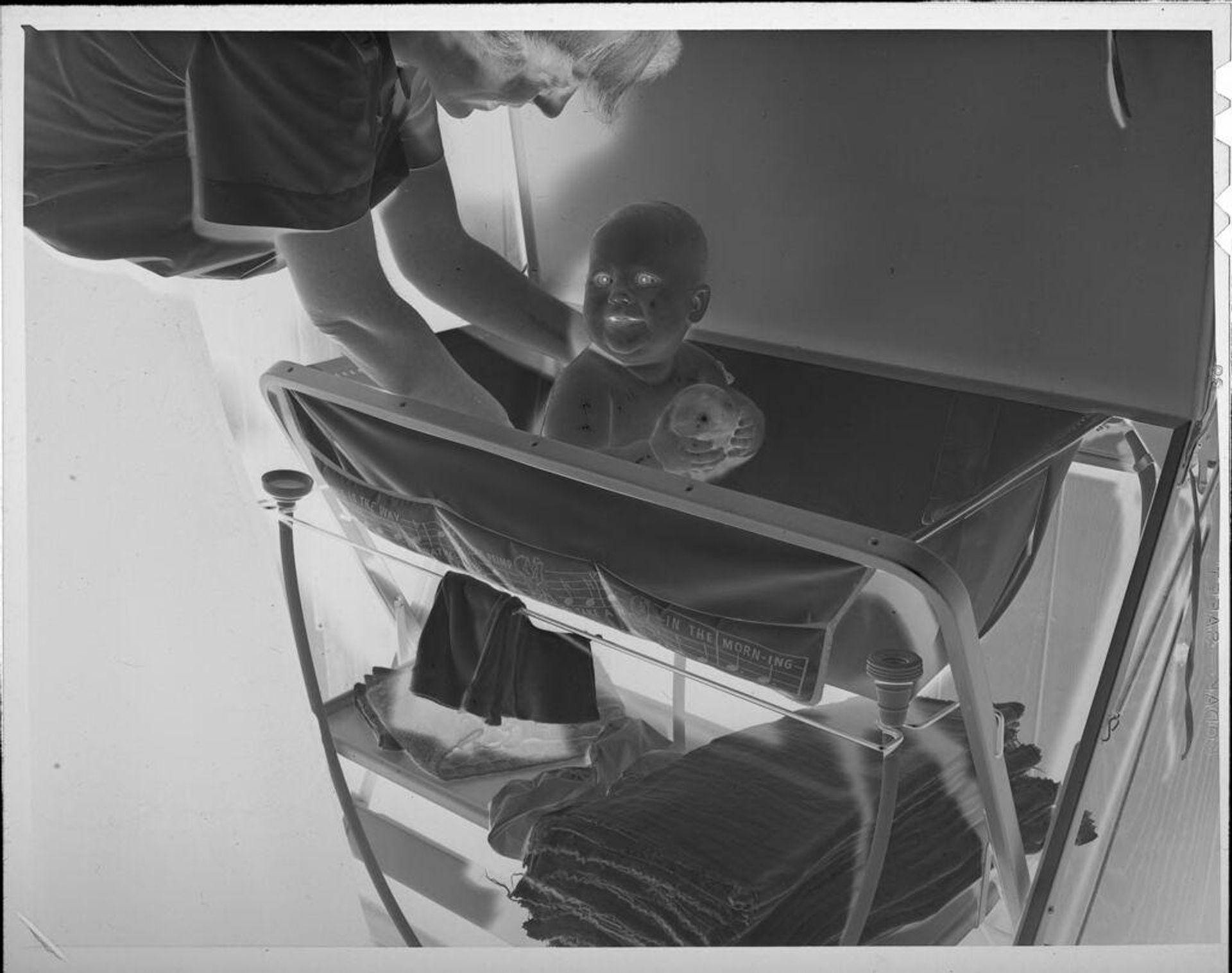Untitled (woman giving baby a bath) by Lucian and Mary Brown