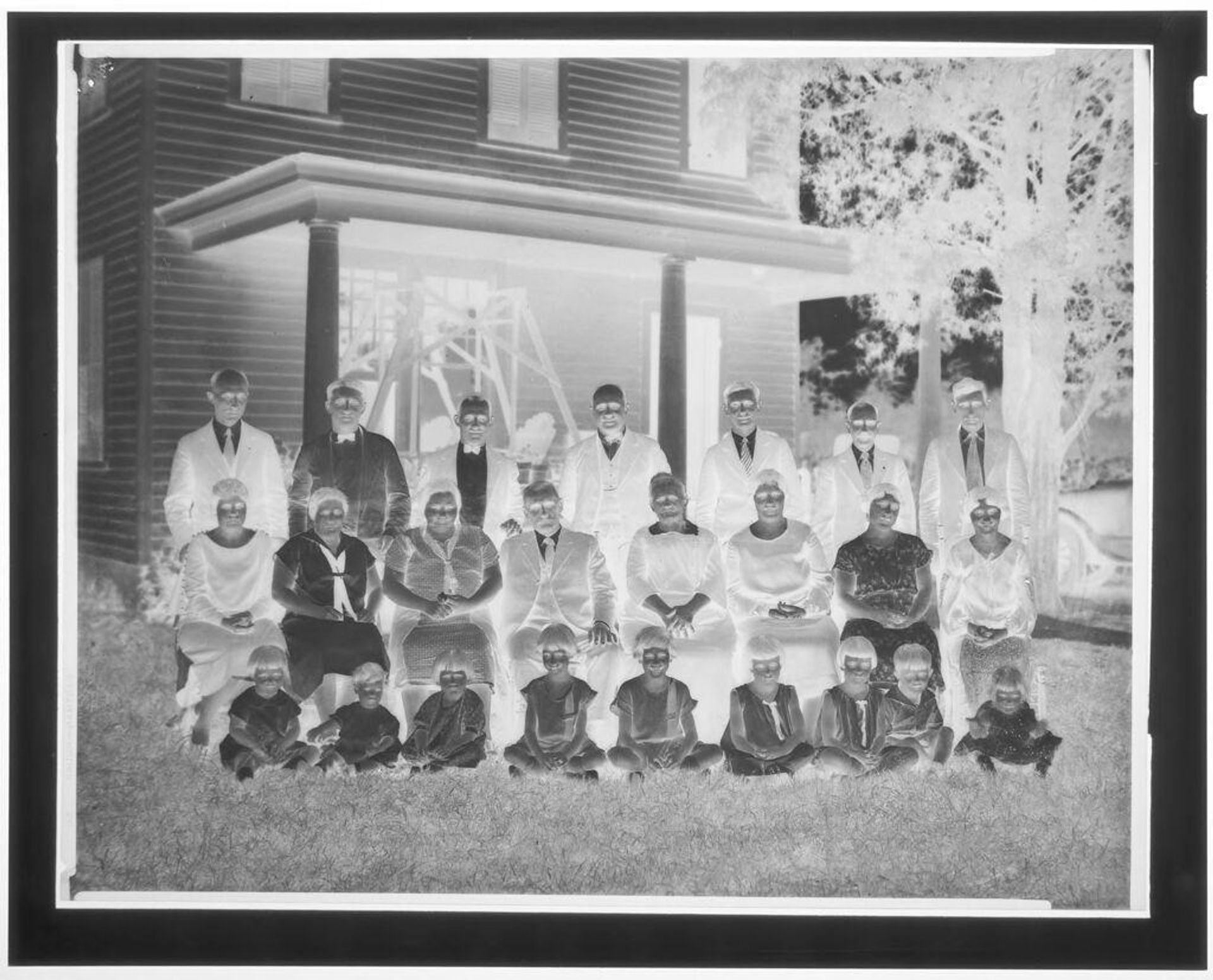 Untitled (family portrait on lawn outside house) by Hamblin Studio