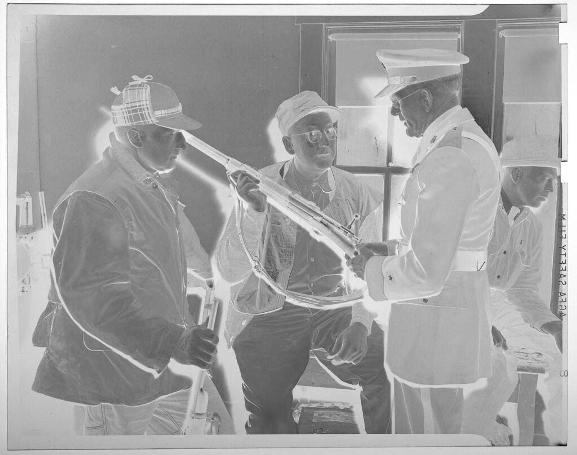 Untitled (hunters and officer looking at shotgun) by Jack Gould