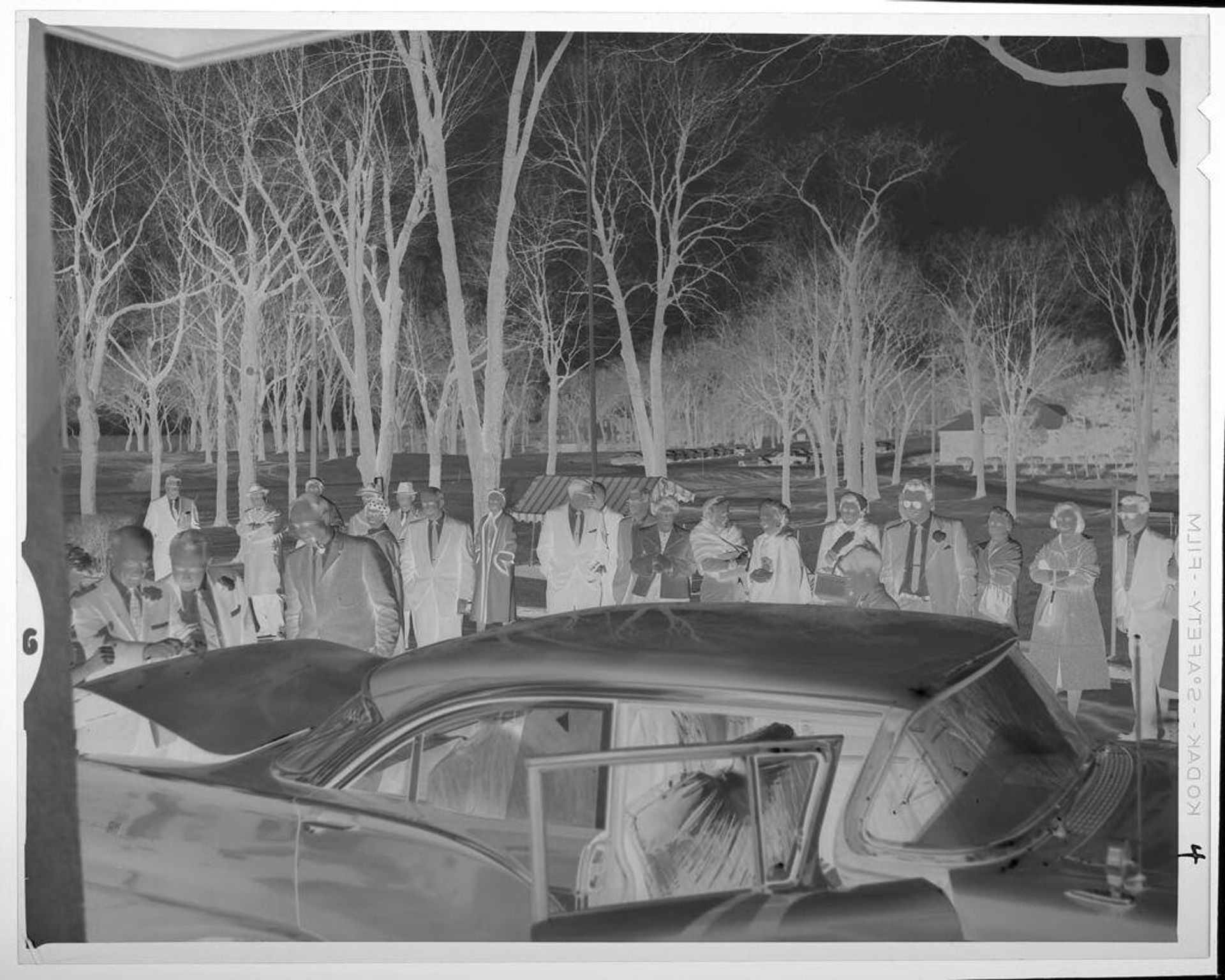 Untitled (people gathered around car) by Lucian and Mary Brown
