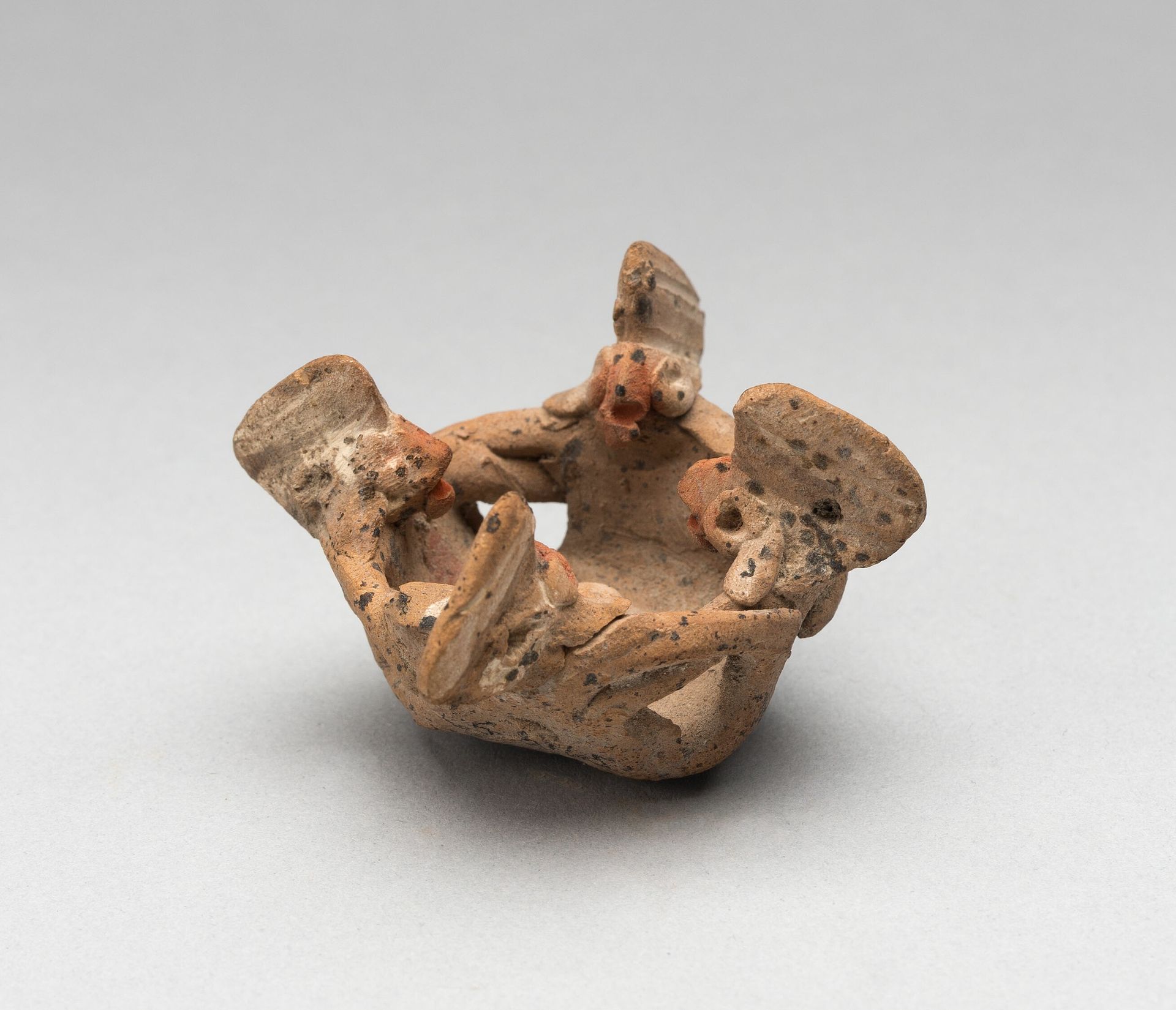 Miniature Group of Four Figures in a Circle with Linked Arms by Chupícuaro