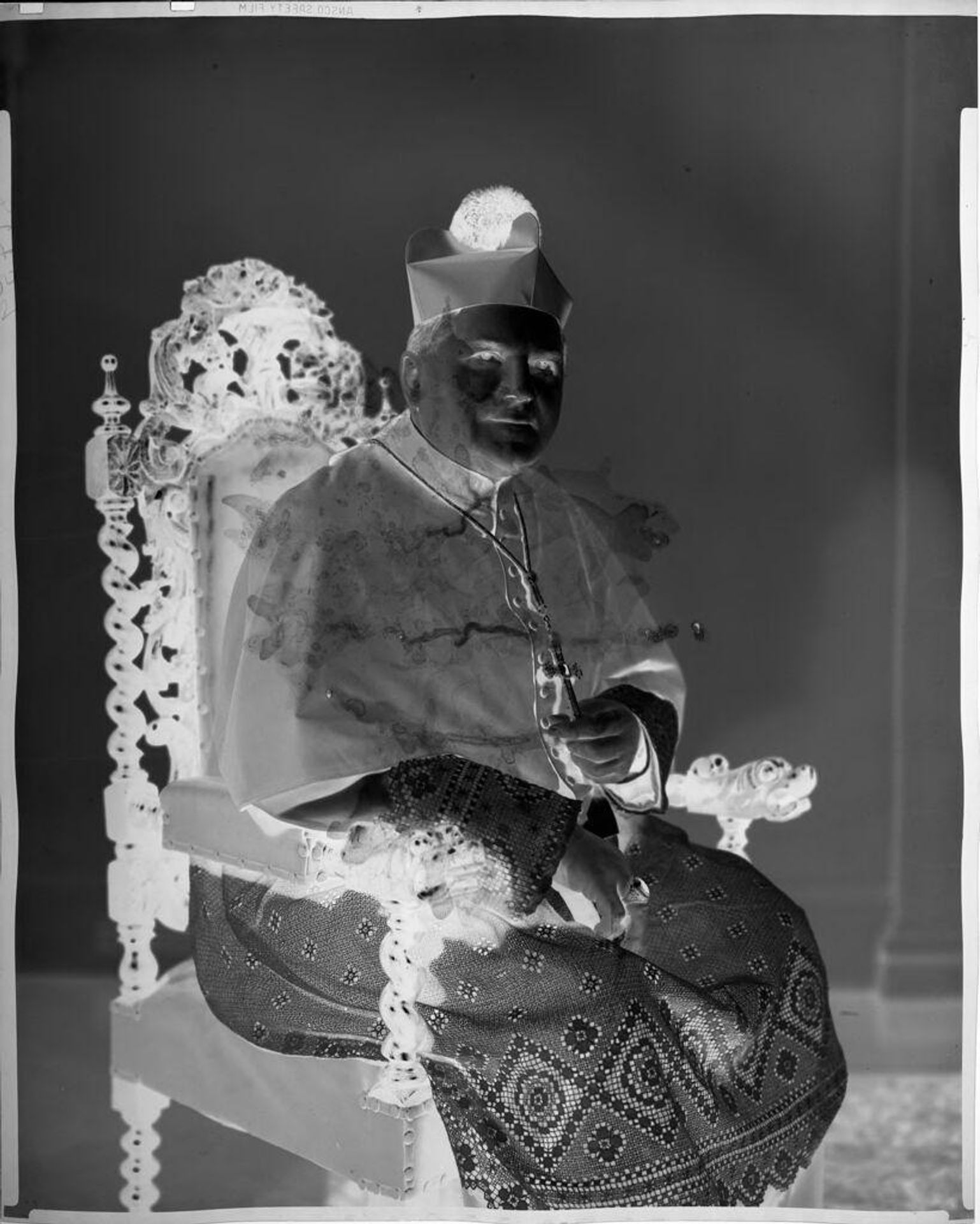Untitled (church Cardinal sitting in chair) by C. Bennette Moore