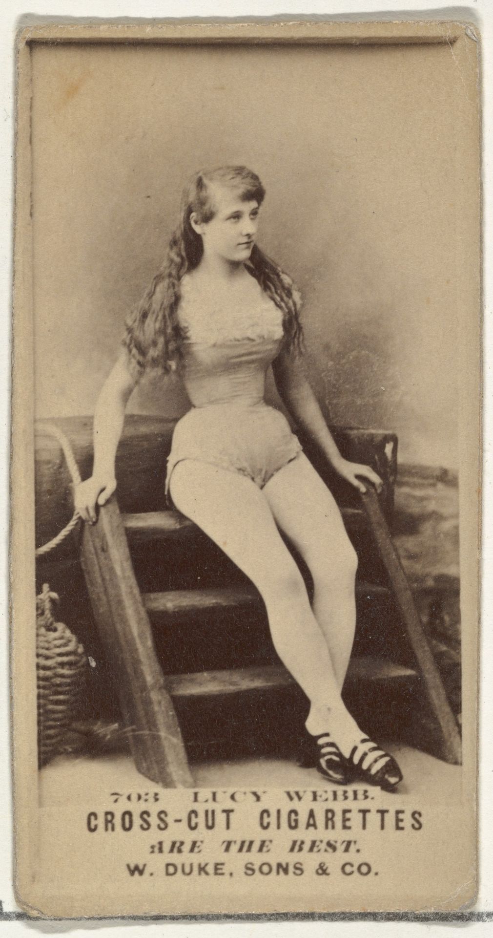 Card Number 703, Lucy Webb, from the Actors and Actresses series (N145-3) issued by Duke Sons & Co. to promote Cross Cut Cigarettes by W. Duke, Sons & Co.