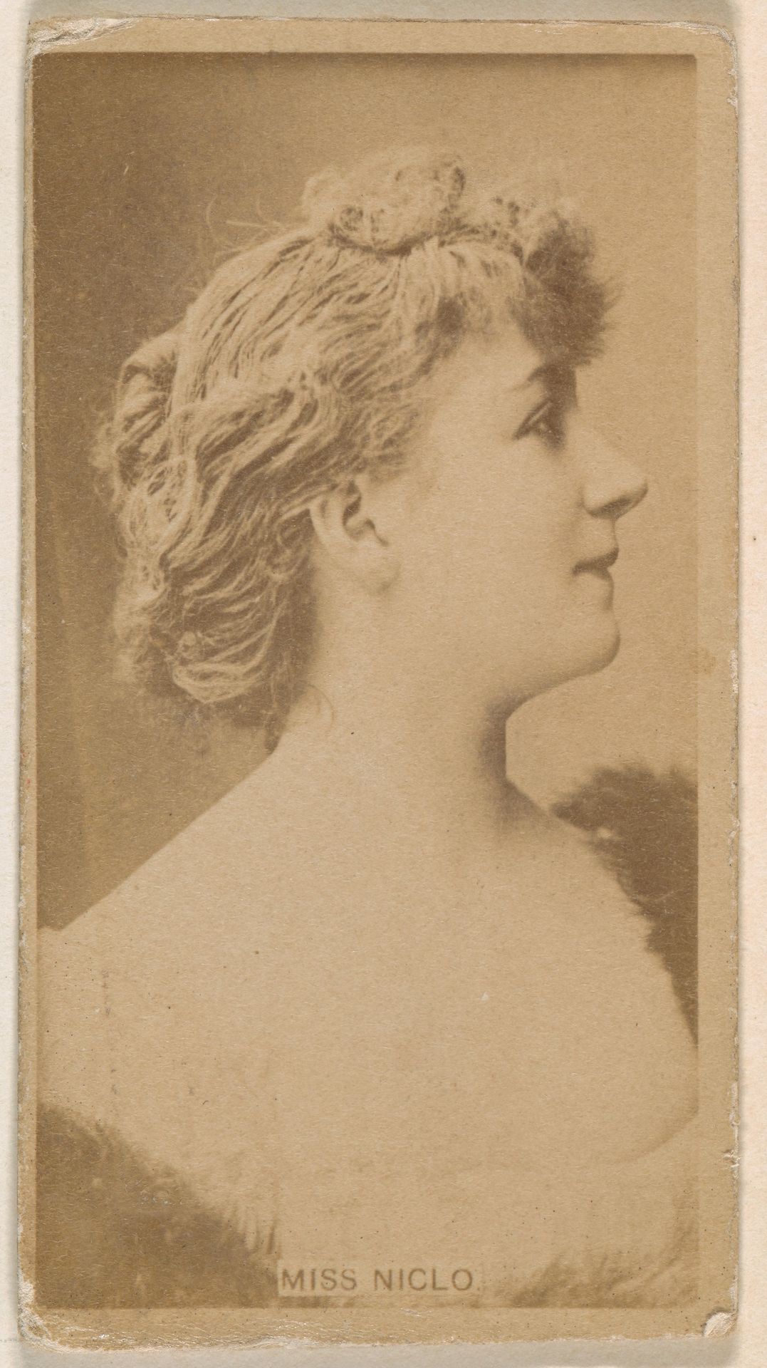 Miss Niglo, from the Actresses series (N245) issued by Kinney Brothers to promote Sweet Caporal Cigarettes by Kinney Brothers Tobacco Company