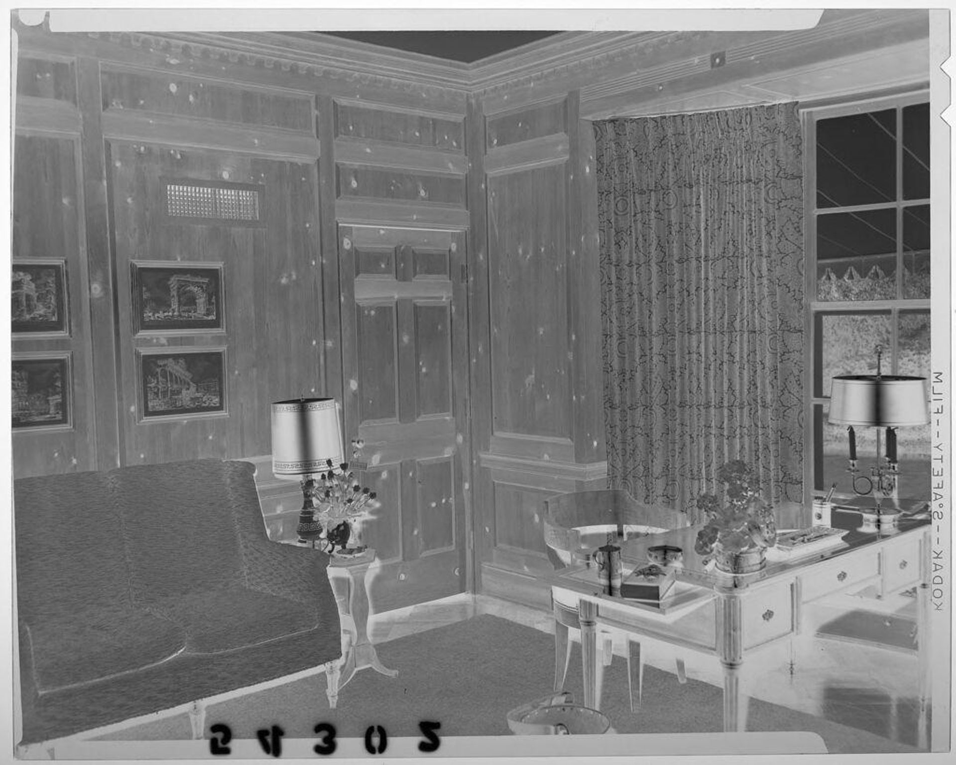 Untitled (interior of den with loveseat and desk by window) by Martin Schweig