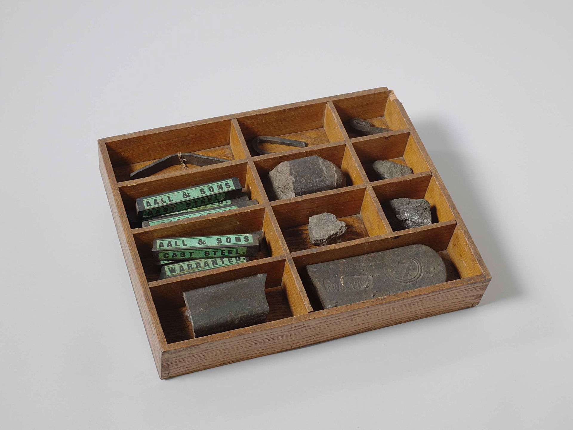 Box with iron, steel and ore samples by Aall & Sons