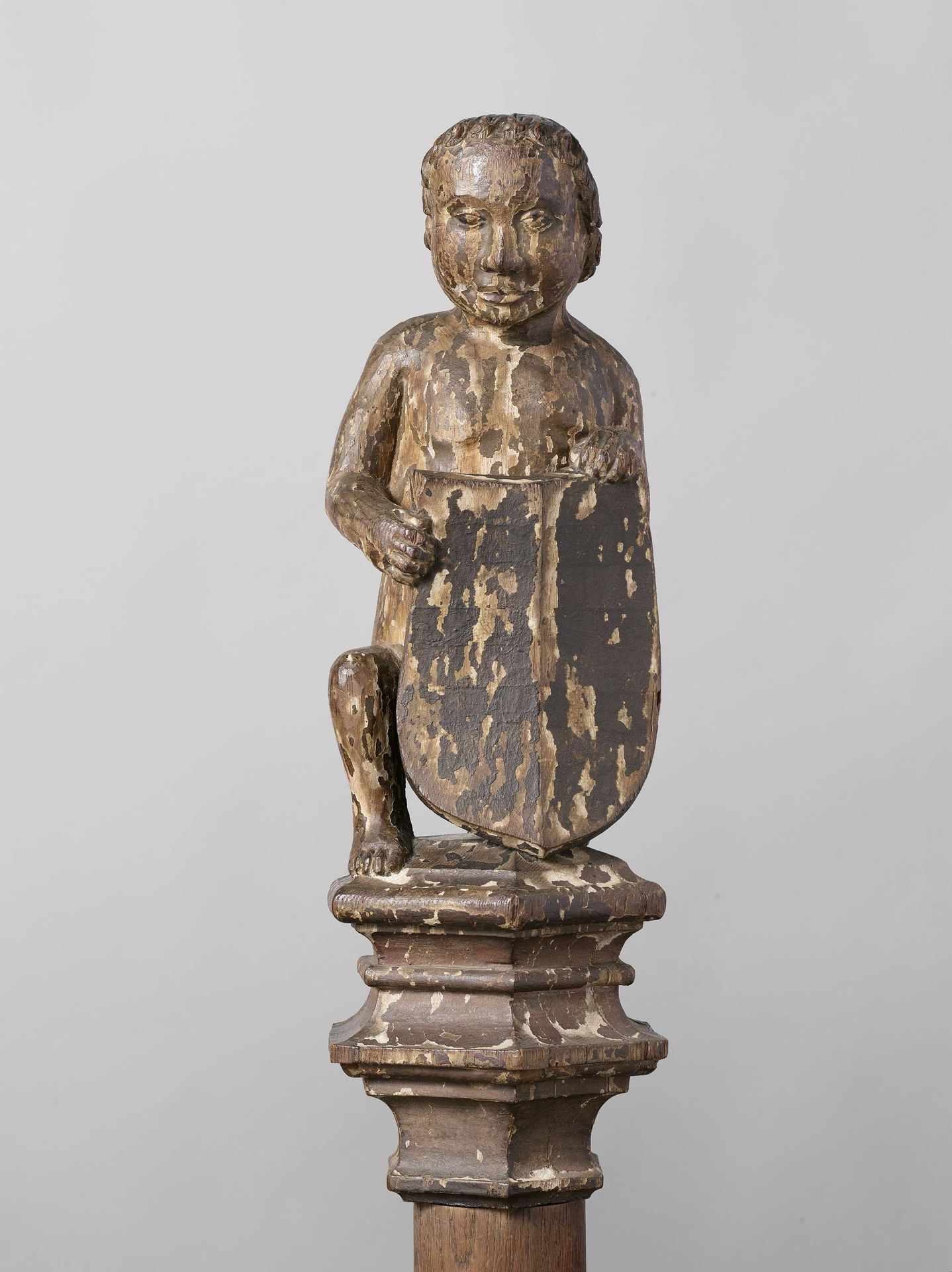 Boy Supporting an Escutcheon, from the Top of a Balustrade or the Backrest of the Stadholder’s Chair in the Rolzaal in the Hof van Holland, The Hague by Joost Janszoon