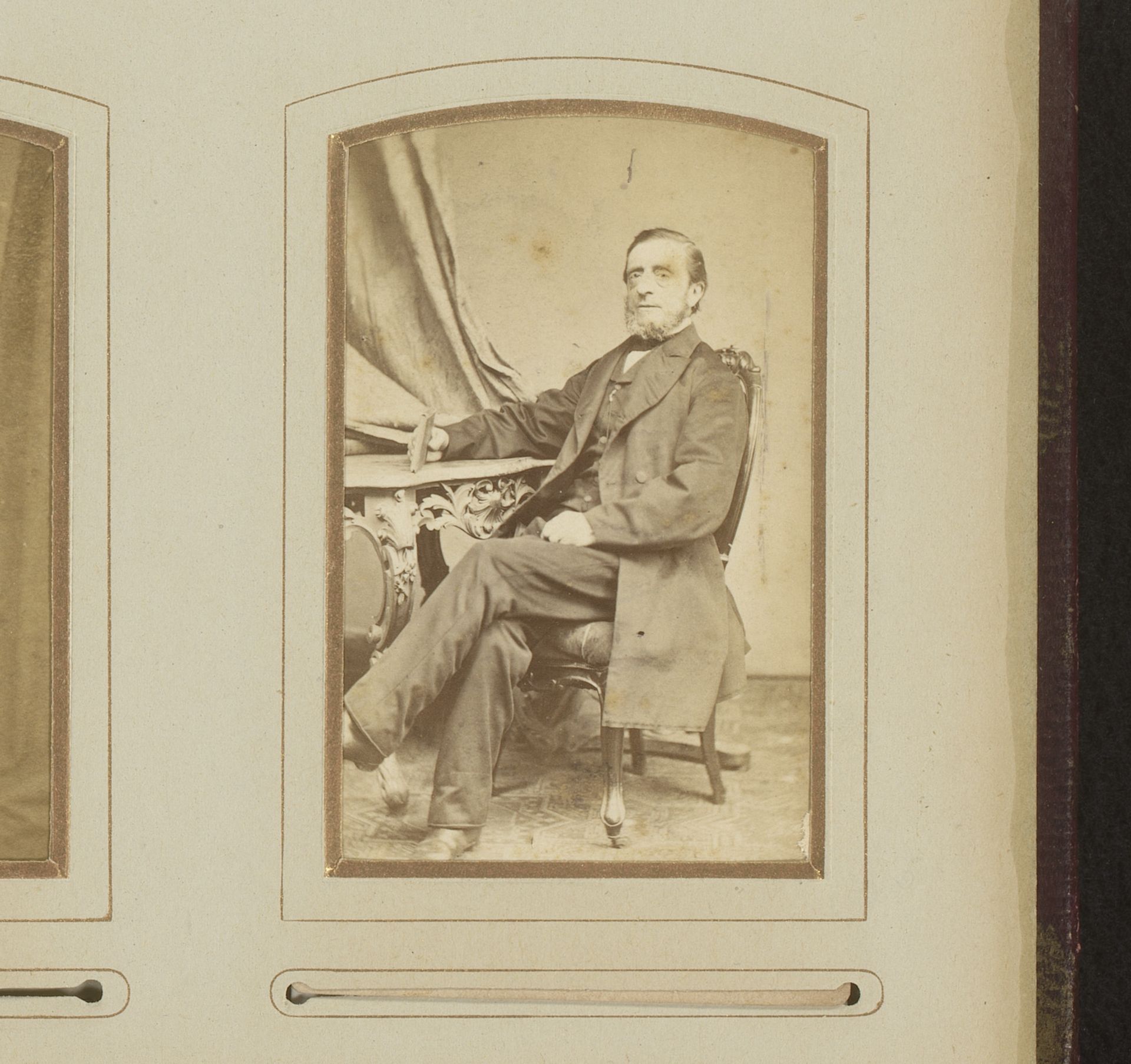 Portret van een man, zittend aan een tafel met boek in de hand by Louis Robert Werner