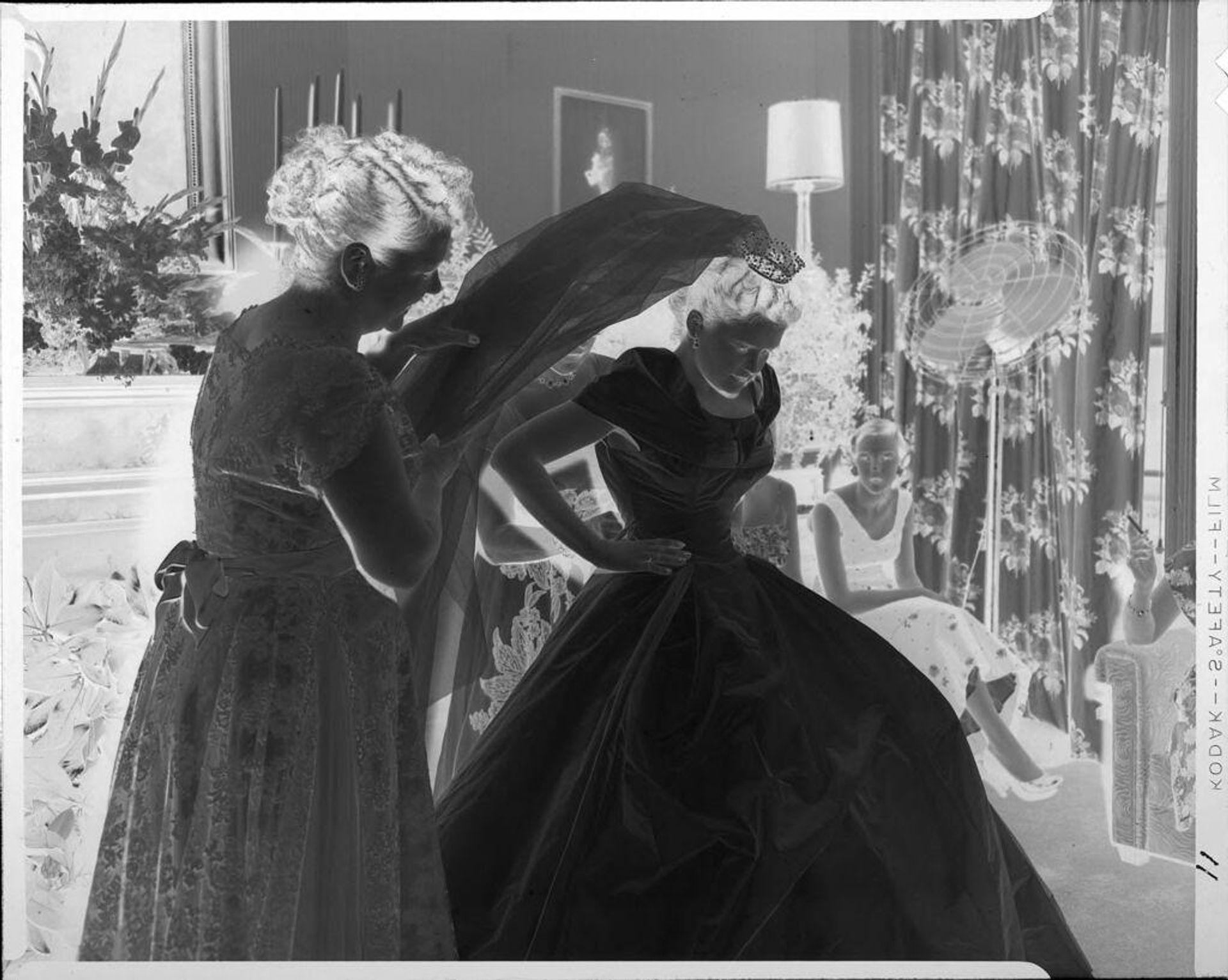 Untitled (Eugenie Stoll dressing for her wedding) by Phyllis Moore Stoll