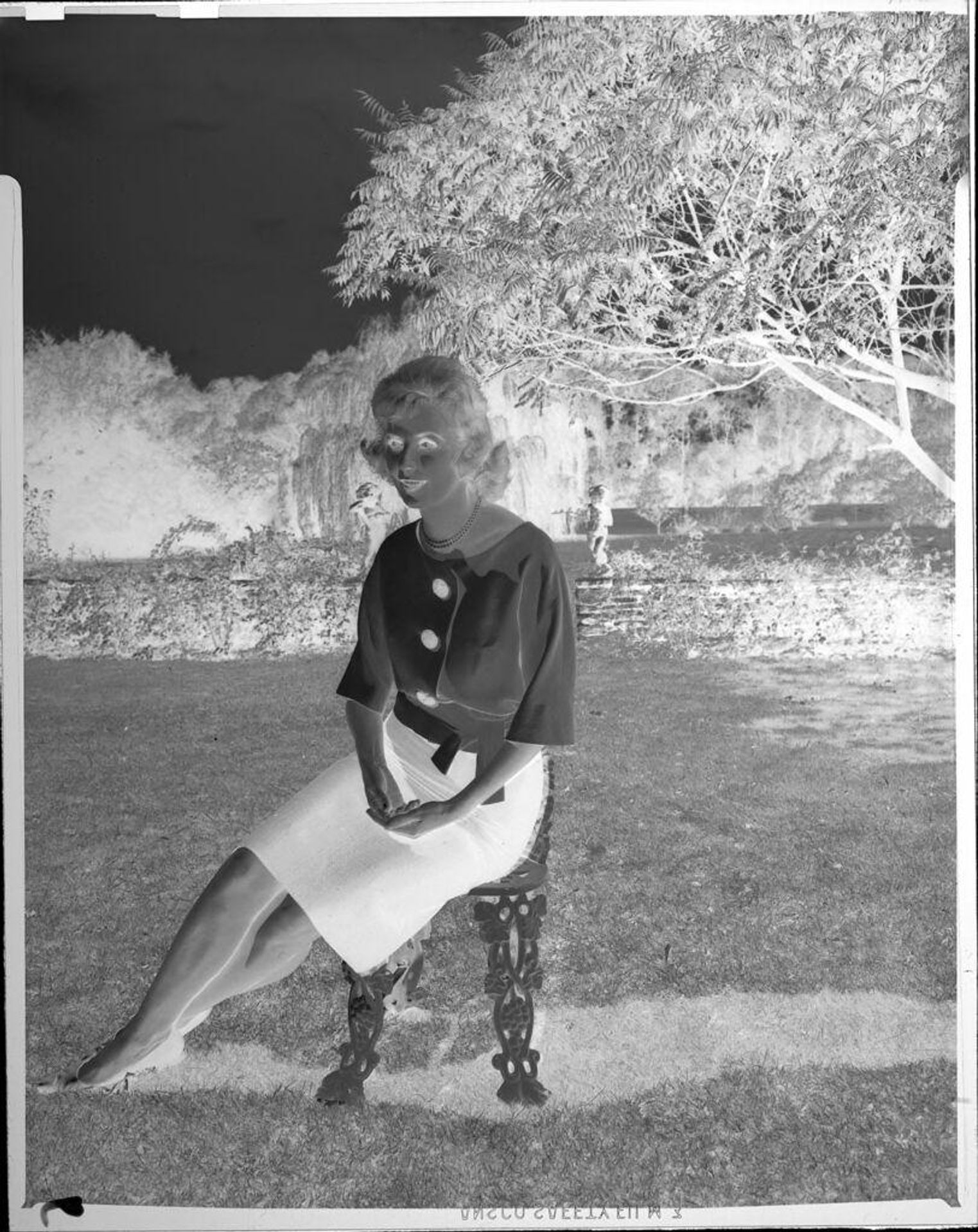 Untitled (woman on chair outside) by John Howell