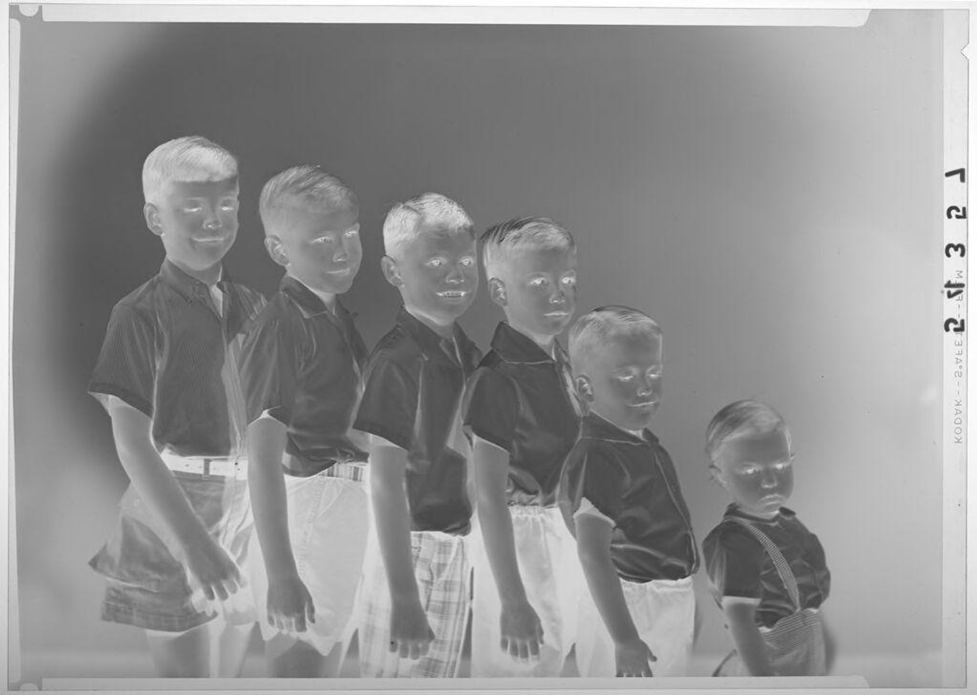 Untitled (studio portrait of six young boys arranged from tallest to shortest) by Martin Schweig