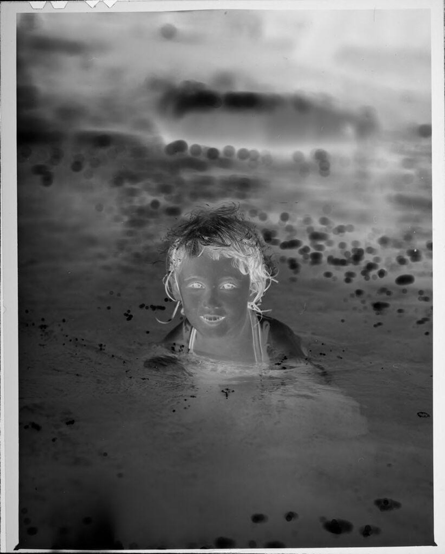 Untitled (little girl in water) by Lucian and Mary Brown