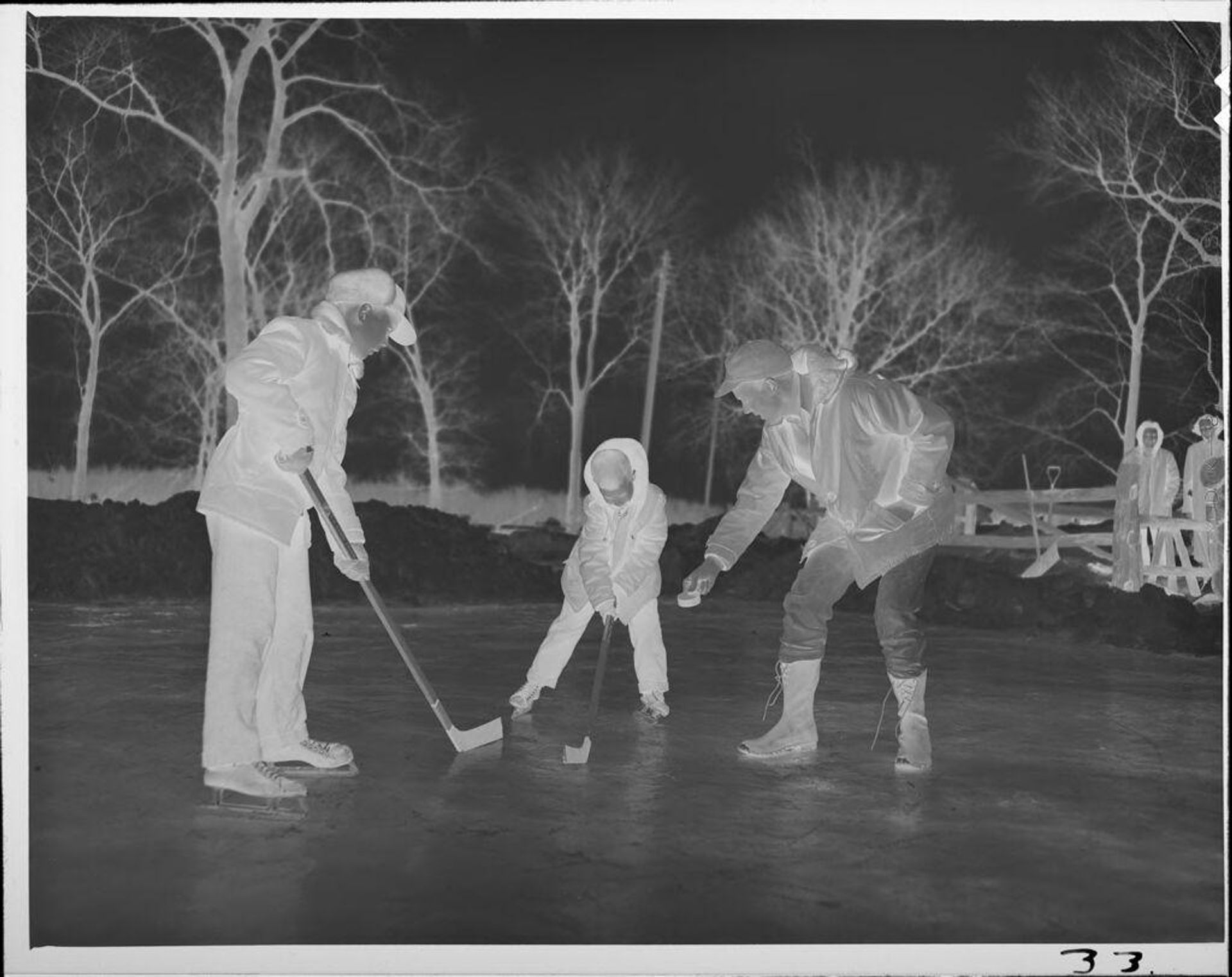 Untitled (boys playing ice hockey) by Lucian and Mary Brown
