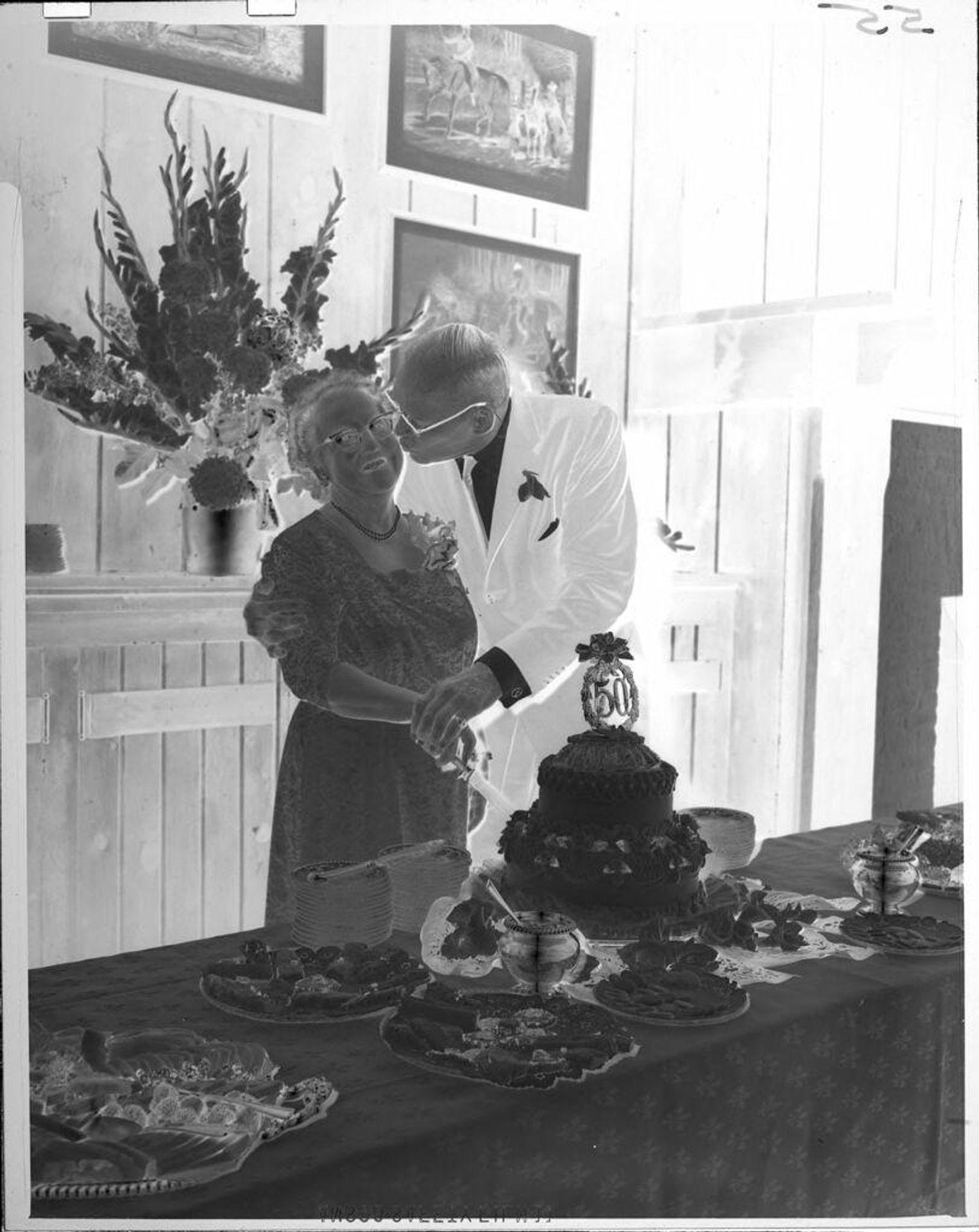 Untitled (couple with cake on 50th Anniversary) by John Howell