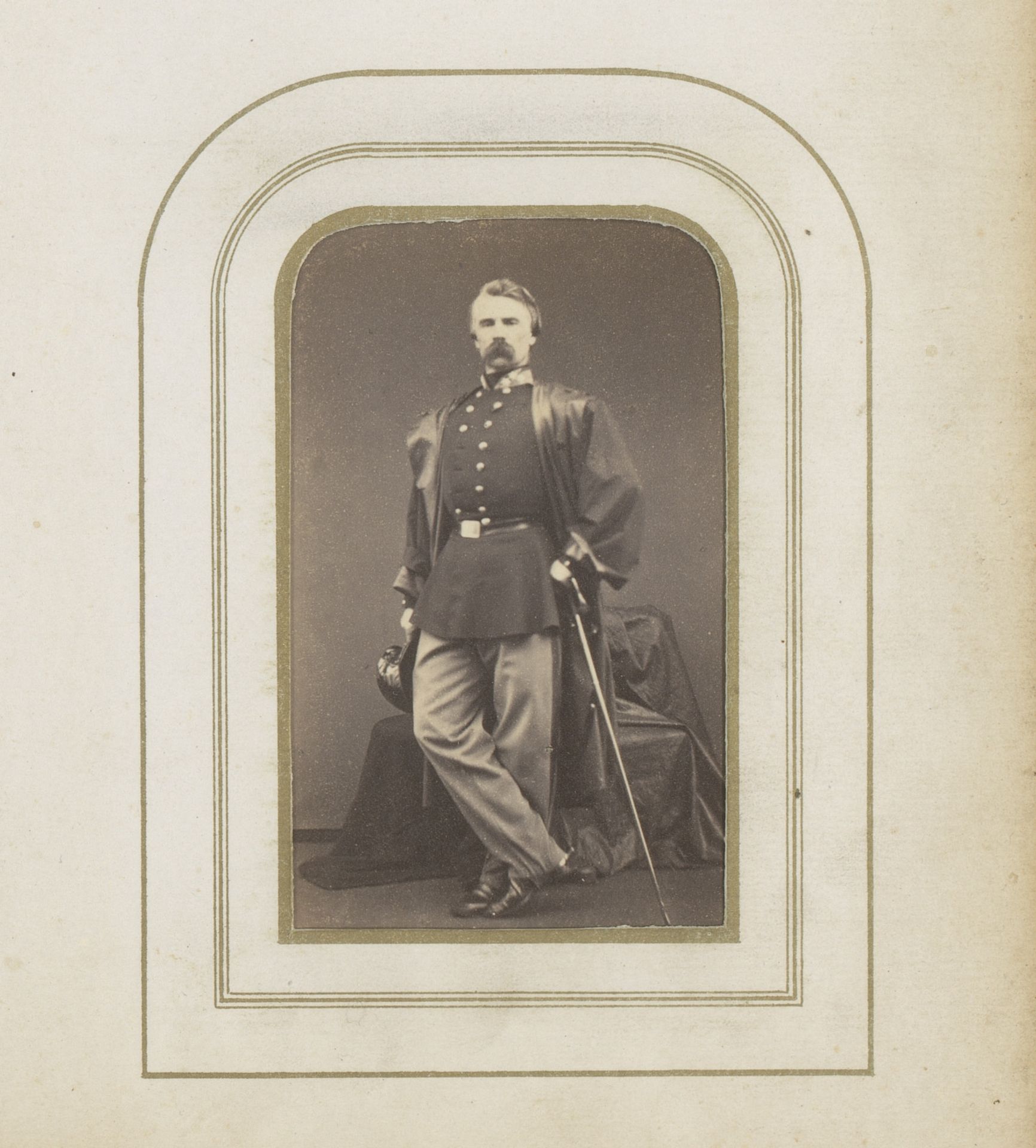 Portret van een man in uniform met pet en wandelstok by Prosper Bevierre