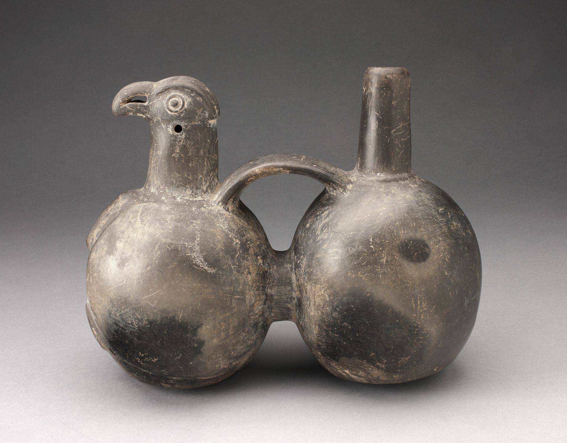 Double-Chambered Strap Vessel with Sculpted Bird Head by Chimú