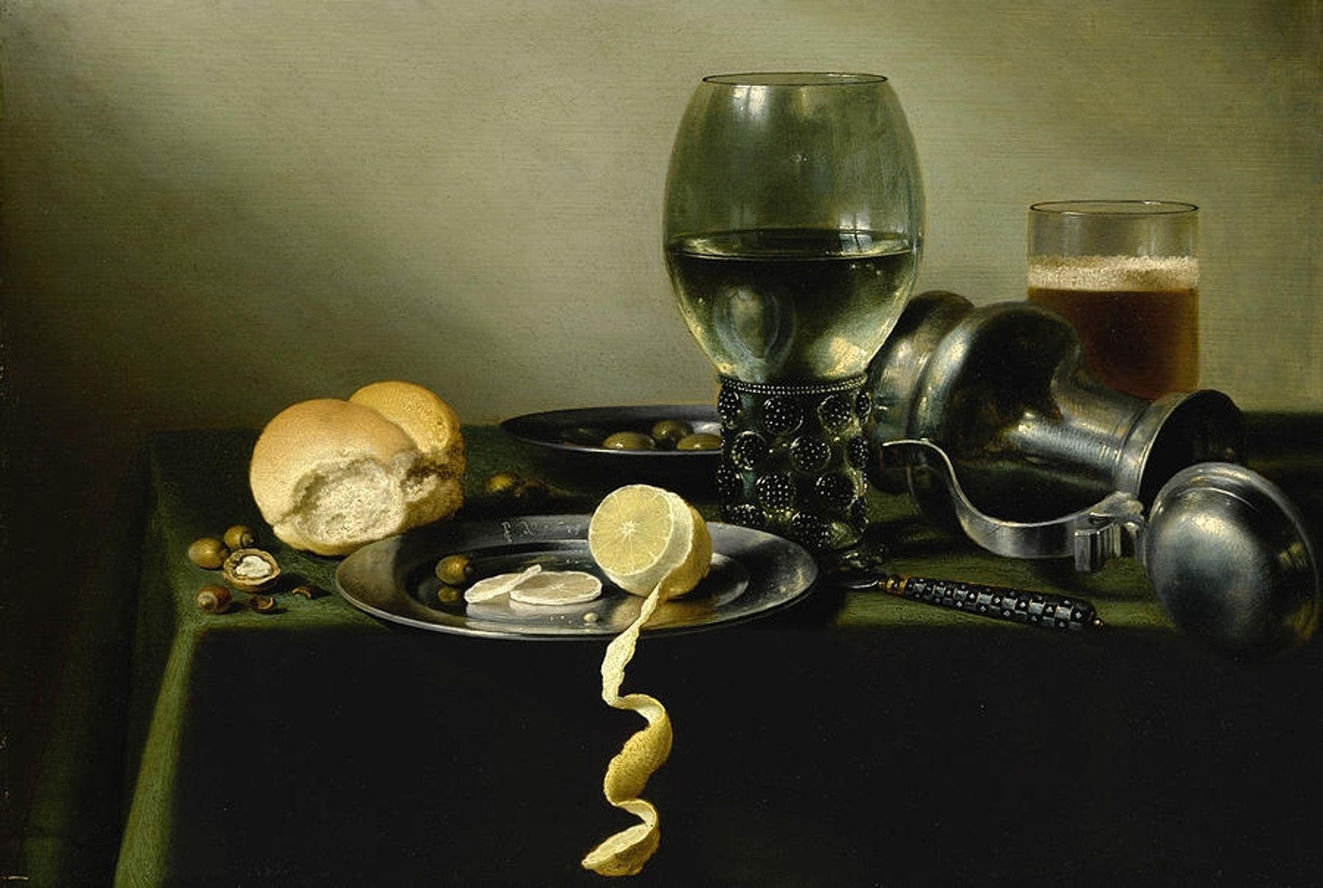 A Roemer An Overturned Pewter Jugolives Half Peeled Lemon on Pewter Plates by Pieter Claesz