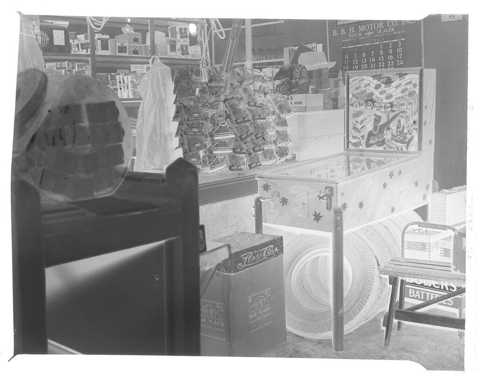 Untitled (Lee's Esso Grill, interior, pinball machine) by Hamblin Studio