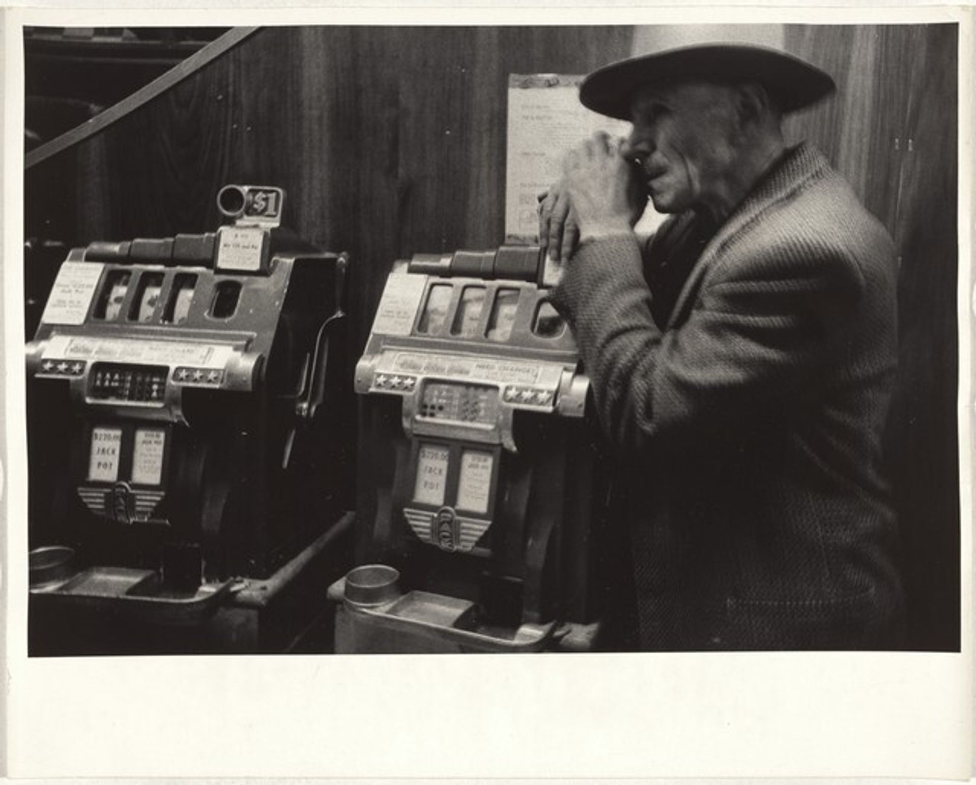 Slot machines--Elko, Nevada by Robert Frank