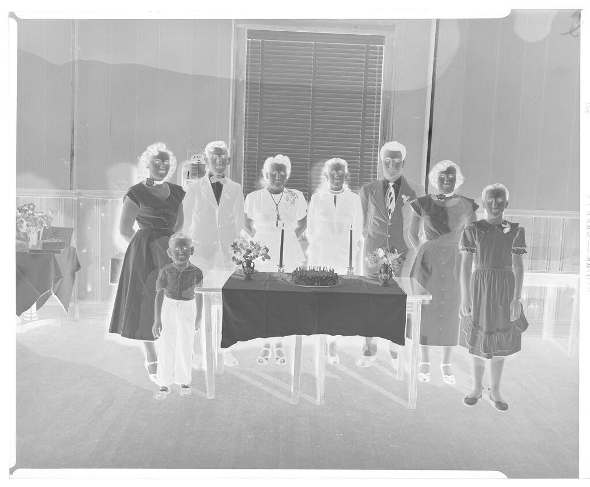 Untitled (small group standing around birthday cake) by Hamblin Studio