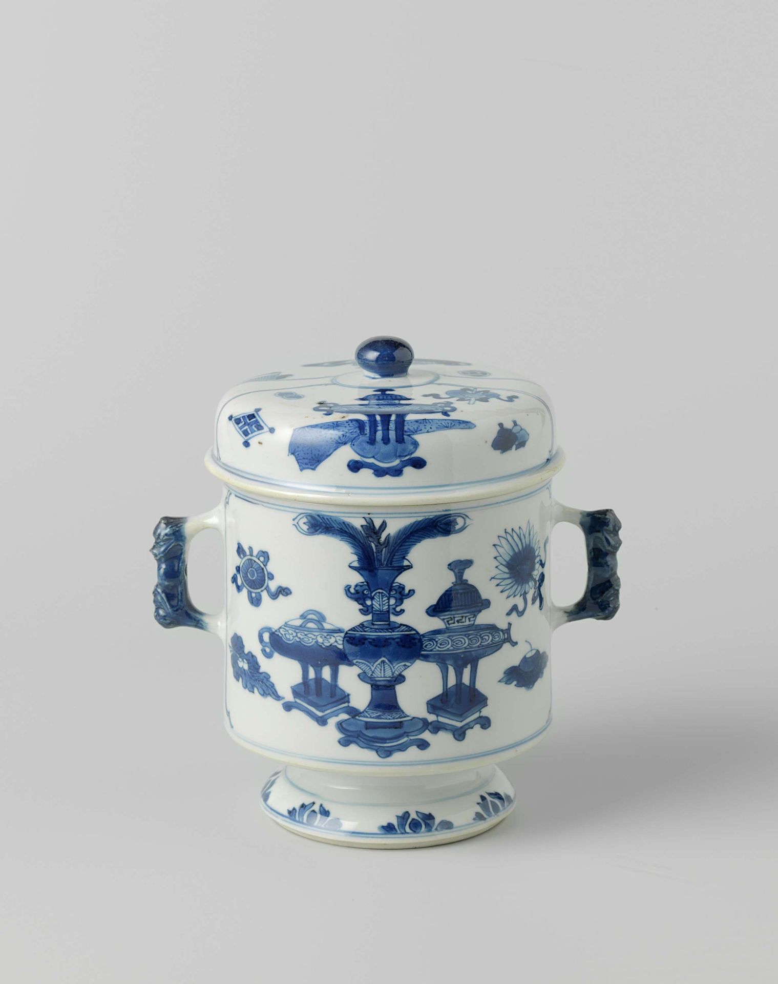 Cylindrical covered jar on foot with precious objects and antiquities by Anonymous