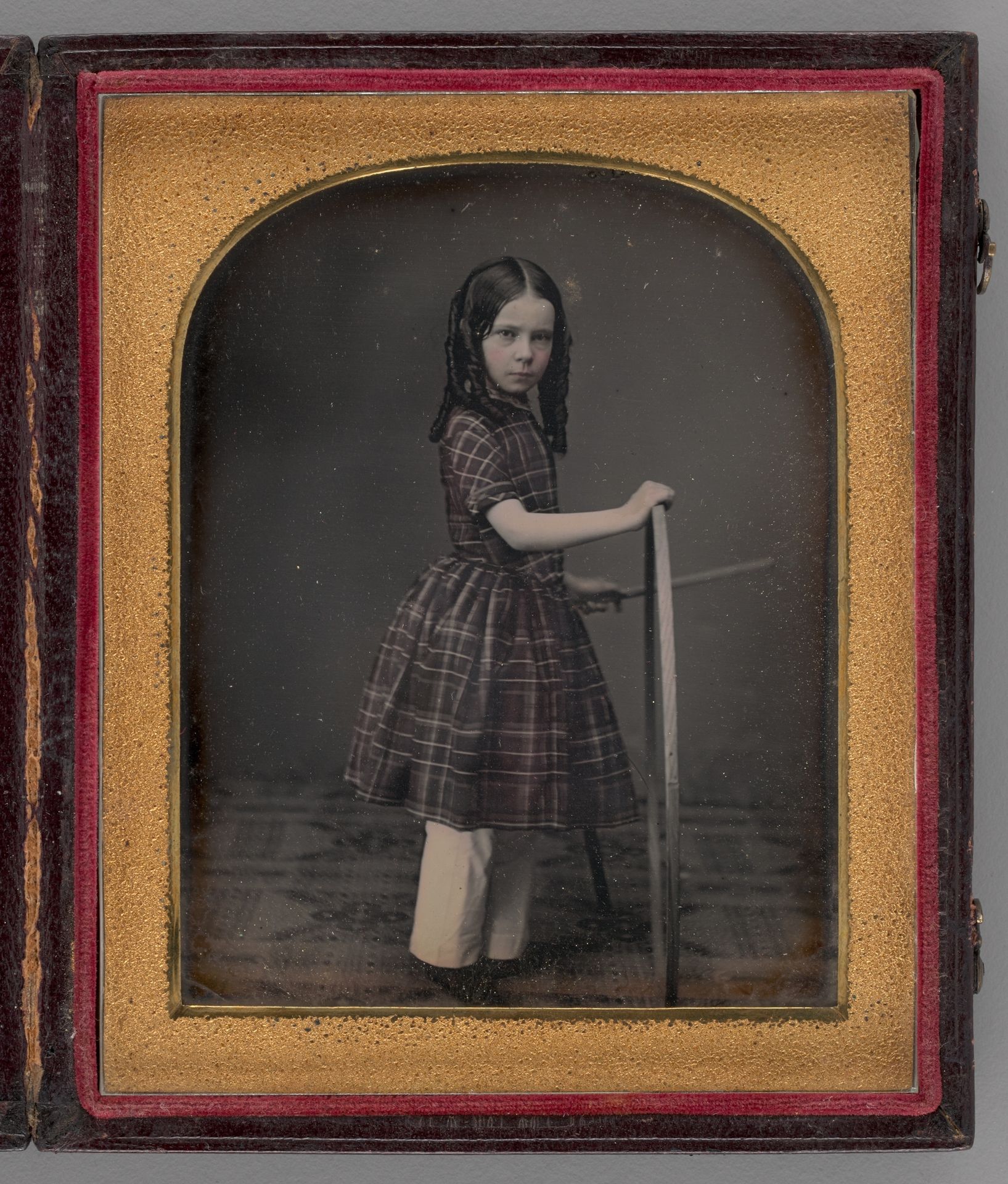 Untitled (Portrait of Girl Holding Stick and Hoop) by Anonymous
