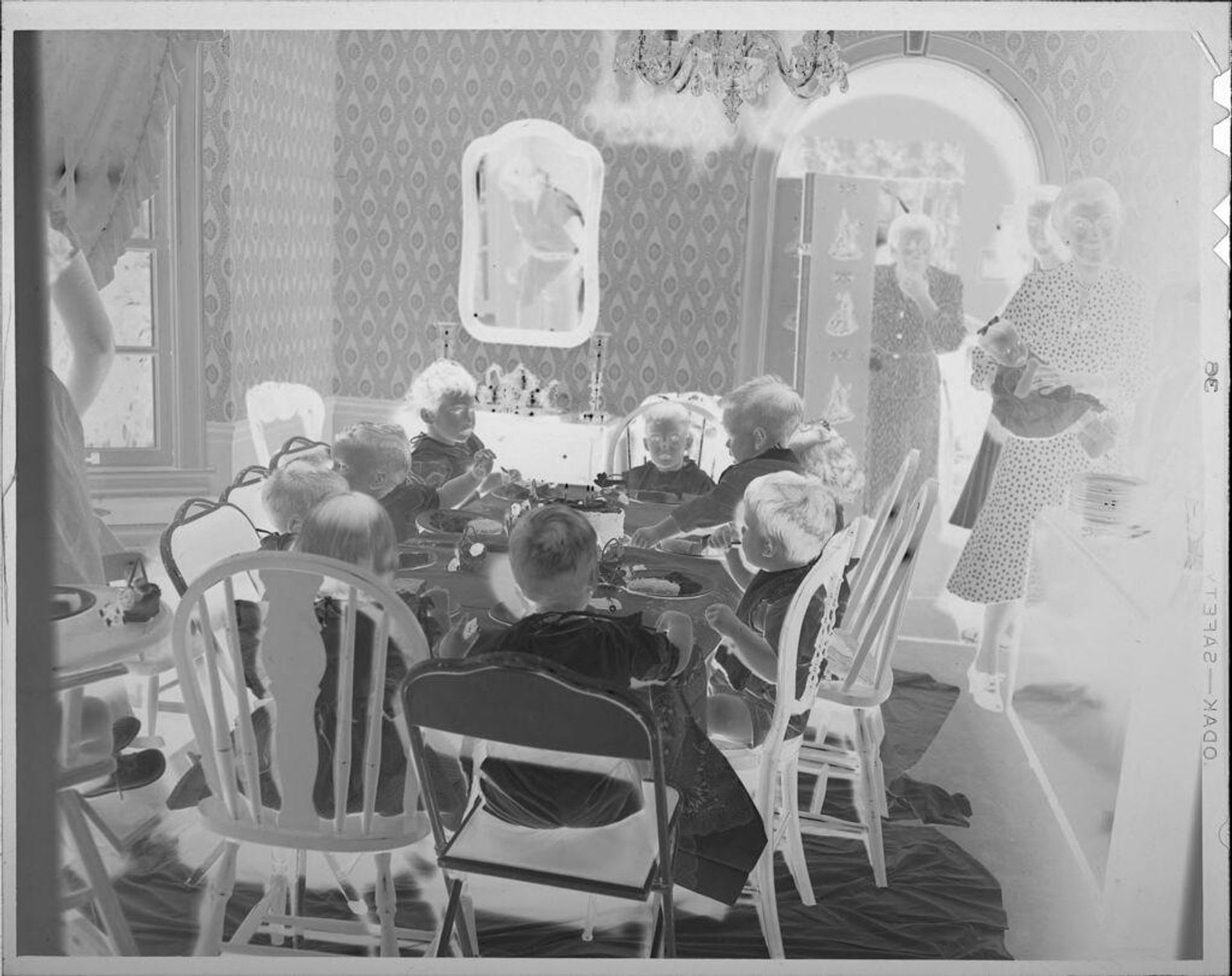 Untitled (children eating at table) by Lucian and Mary Brown