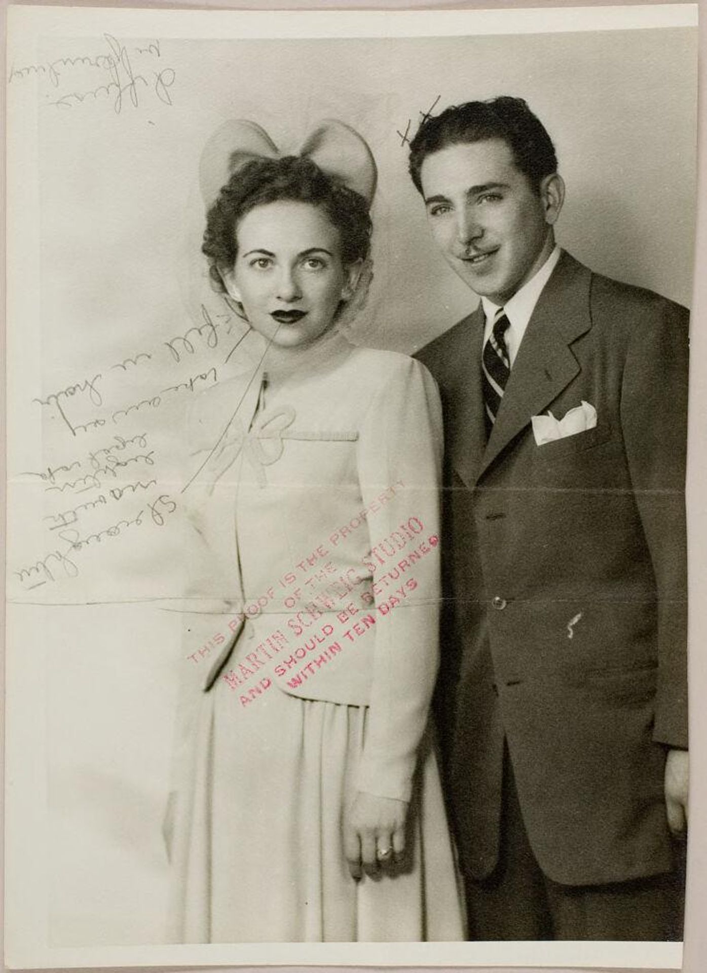 Untitled (studio portrait of newlywed couple with woman wearing bow-shaped hat) by Martin Schweig