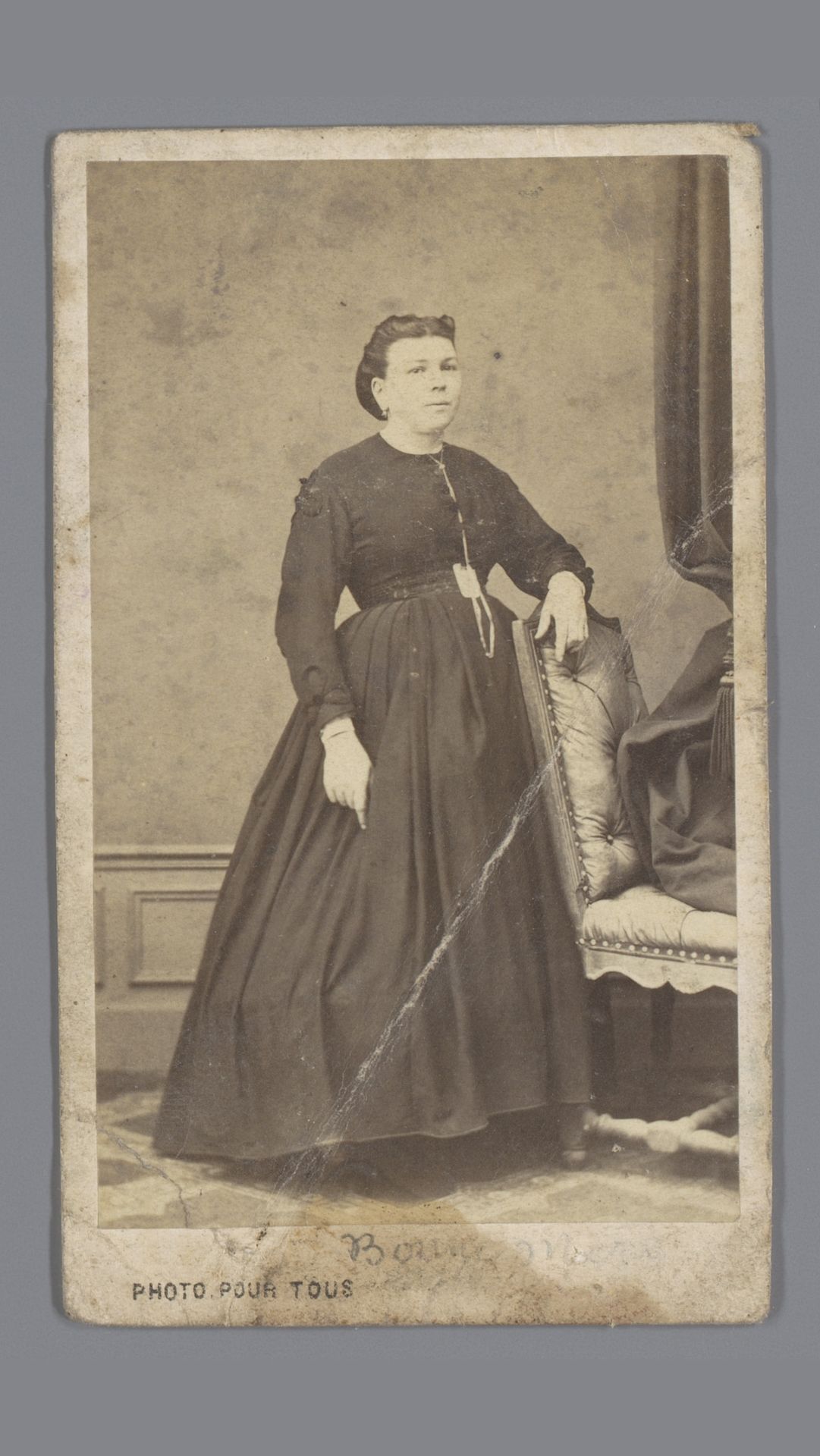 Portret van een onbekende vrouw bij een stoel by Paul Arthur Crosnier