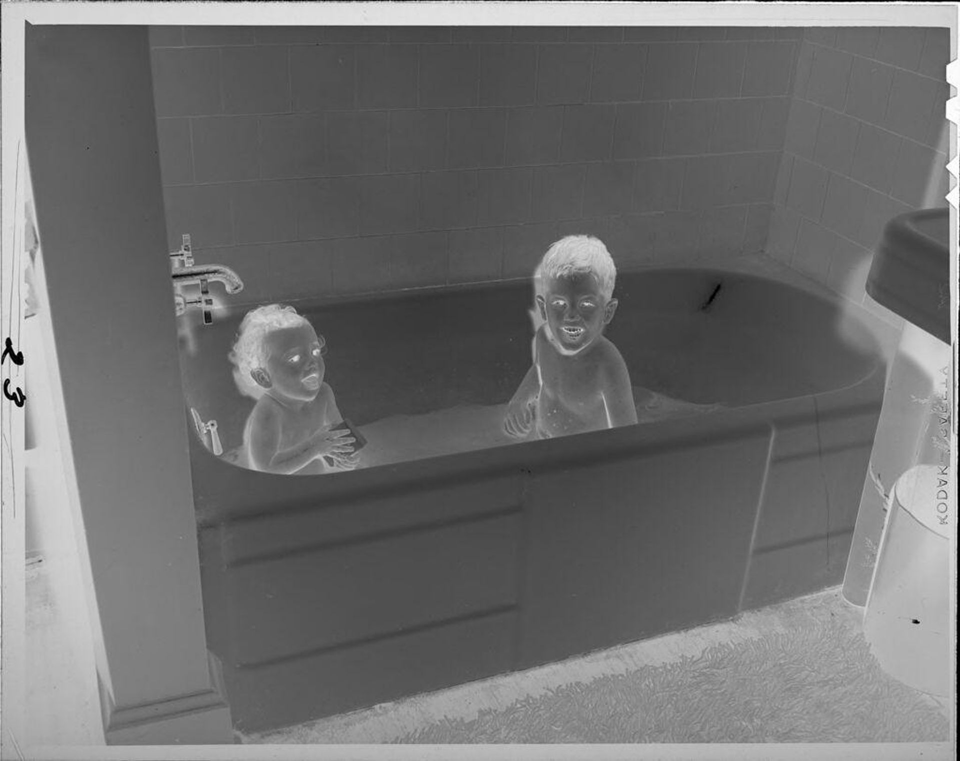 Untitled (two children in bathtub) by Lucian and Mary Brown